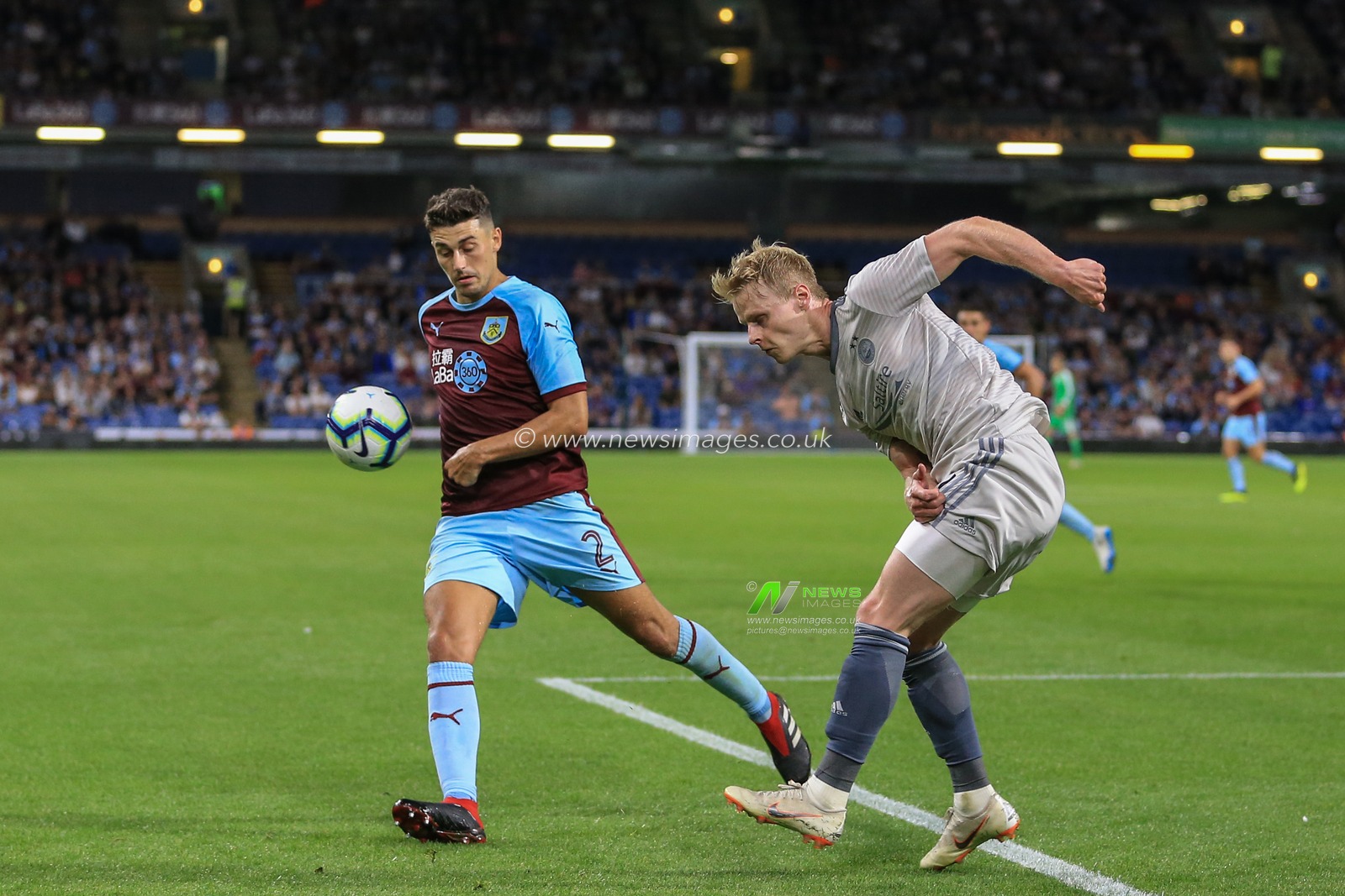 2nd August 2018, Turf Moor, Burnley, England; UAFA Europa League Qualifying Second Round Burnley v Aberdeen; Gary Mackay-Steven of Aberdeen clears the ball as Matthew Lowton (2) of Burnley pressures