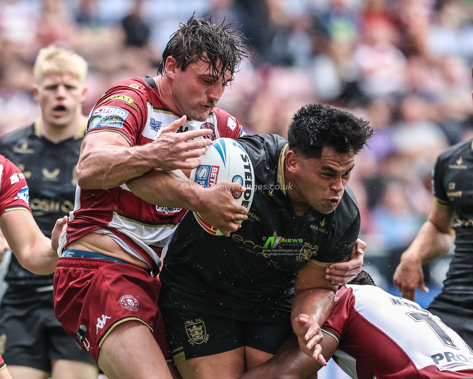 Herman Ese’ese of Hull FC is tackled during the Betfred Super League Round 19 match Wigan Warriors vs Hull FC at The Brick Community Stadium, Wigan, United Kingdom, 19th July 2025

(Photo by Alfie Cosgrove/News Images)