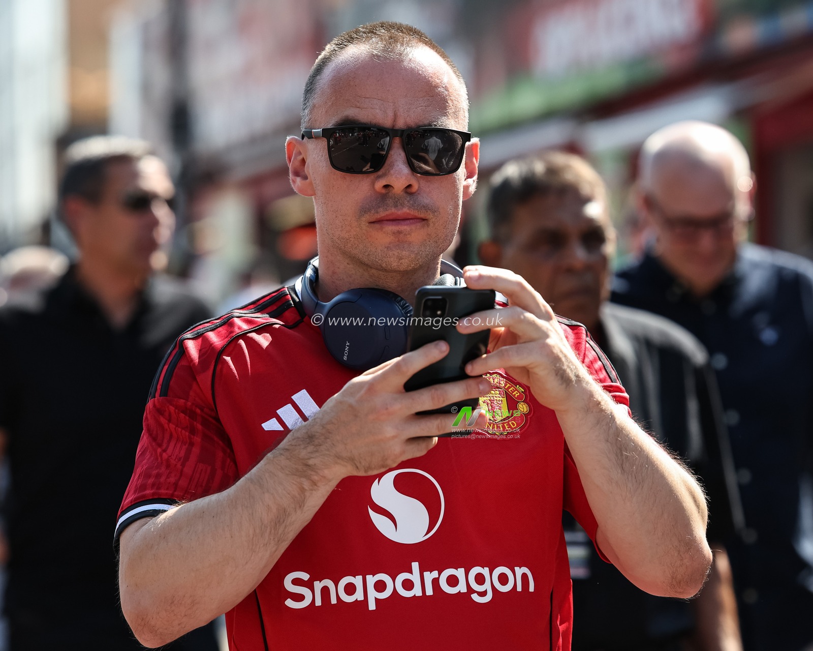 Manchester United fans make their way to Old Trafford during the Premier League match Manchester United vs Arsenal at Old Trafford, Manchester, United Kingdom, 17th August 2025

(Photo by Mark Cosgrove/News Images)