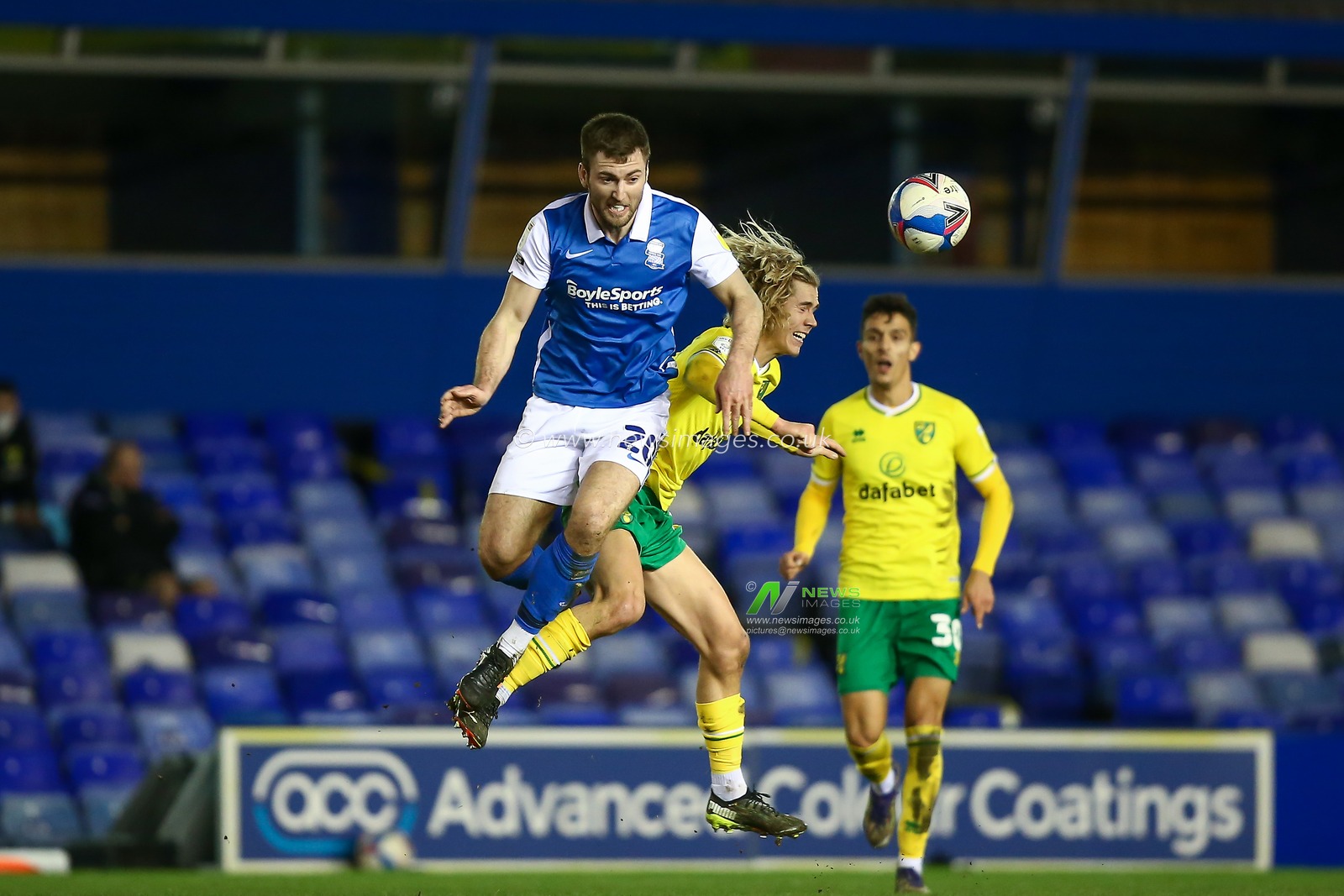 Gary Gardner #20 of Birmingham City and Todd Cantwell #14 of Norwich City compete for the aerial ball
