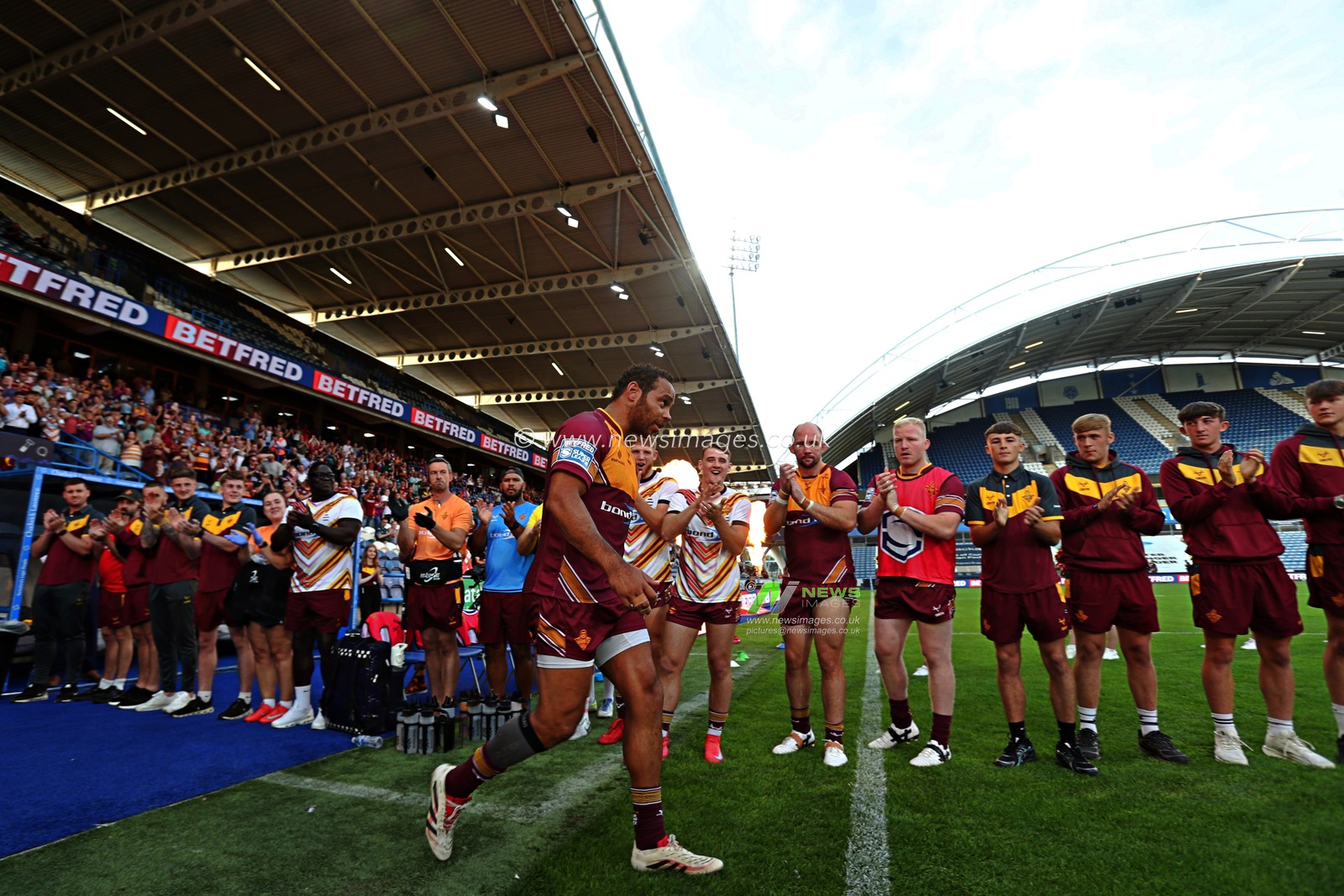 Leroy Cudjoe of Huddersfield Giants walks out to a guard of honour before the Betfred Super League round 19 match Huddersfield Giants vs Wakefield Trinity at the Accu Stadium, Huddersfield, United Kingdom, 18th July 2025(Photo by Sam Eaden/News Images)