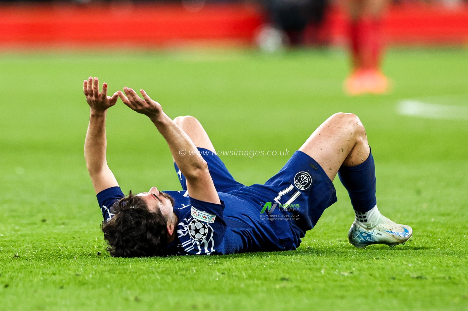 Vitinha of Paris Saint-Germain goes down with injury during the UEFA Champions League Last 16 match Liverpool vs Paris Saint-Germain at Anfield, Liverpool, United Kingdom, 11th March 2025

(Photo by Mark Cosgrove/News Images)