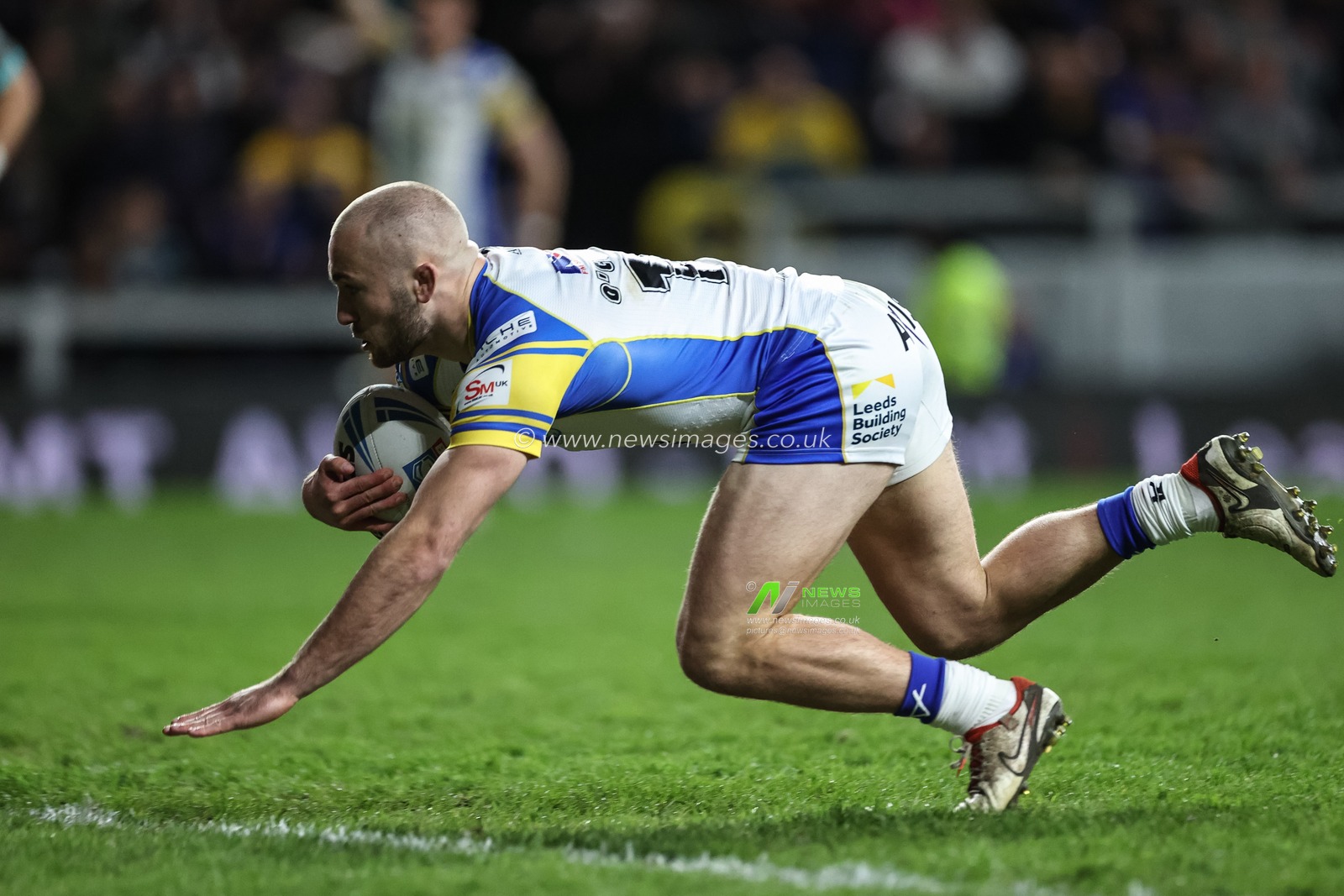 Jarrod Oâ€™Connor of Leeds Rhinos goes over for a try to make it 22-12 during the Betfred Super League Round 8 match Leeds Rhinos vs Huddersfield Giants at Headingley Stadium, Leeds, United Kingdom, 19th April 2024

(Photo by Mark Cosgrove/News Images)