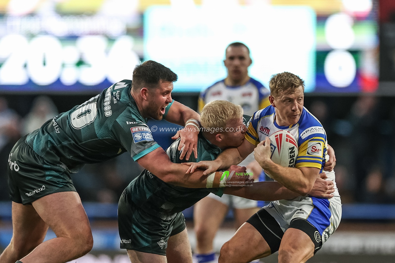 Lachlan Miller of Leeds Rhinos is tackled by Olly Wilson of Huddersfield Giants during the Betfred Super League Round 8 match Leeds Rhinos vs Huddersfield Giants at Headingley Stadium, Leeds, United Kingdom, 19th April 2024

(Photo by Mark Cosgrove/News Images)
