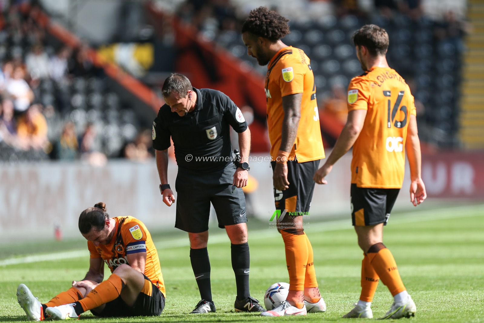Lewis Coyle #2 of Hull City sits on the ground injured