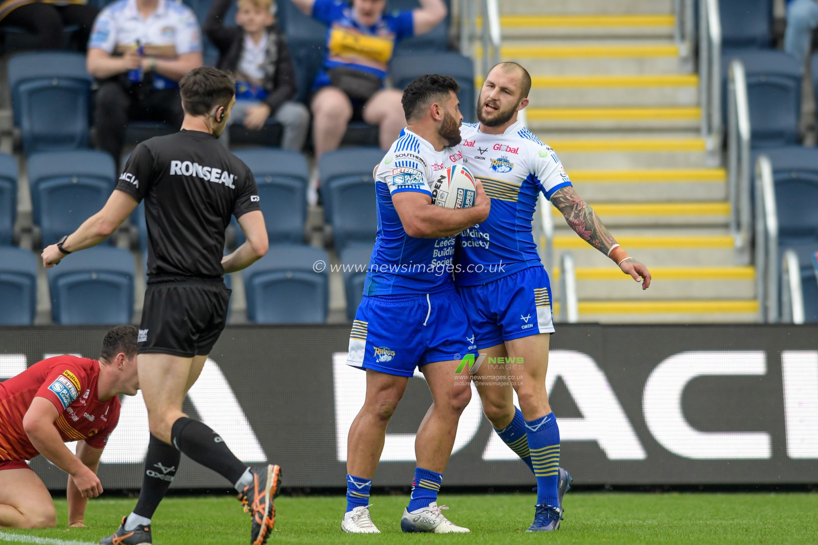 Rhyse Martin (12) of Leeds Rhinos celebrates scoring a try with Luke Briscoe (24) of Leeds Rhinos to make it 4-8