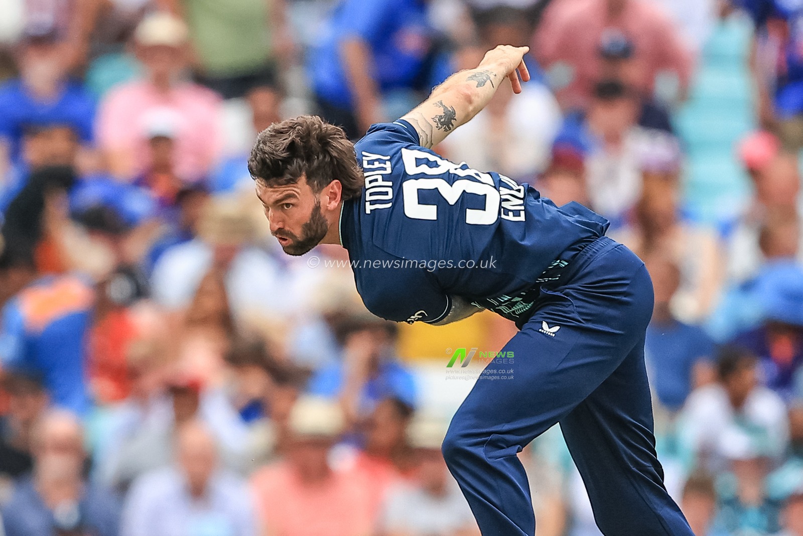 Reece Topley of England delivers the ball