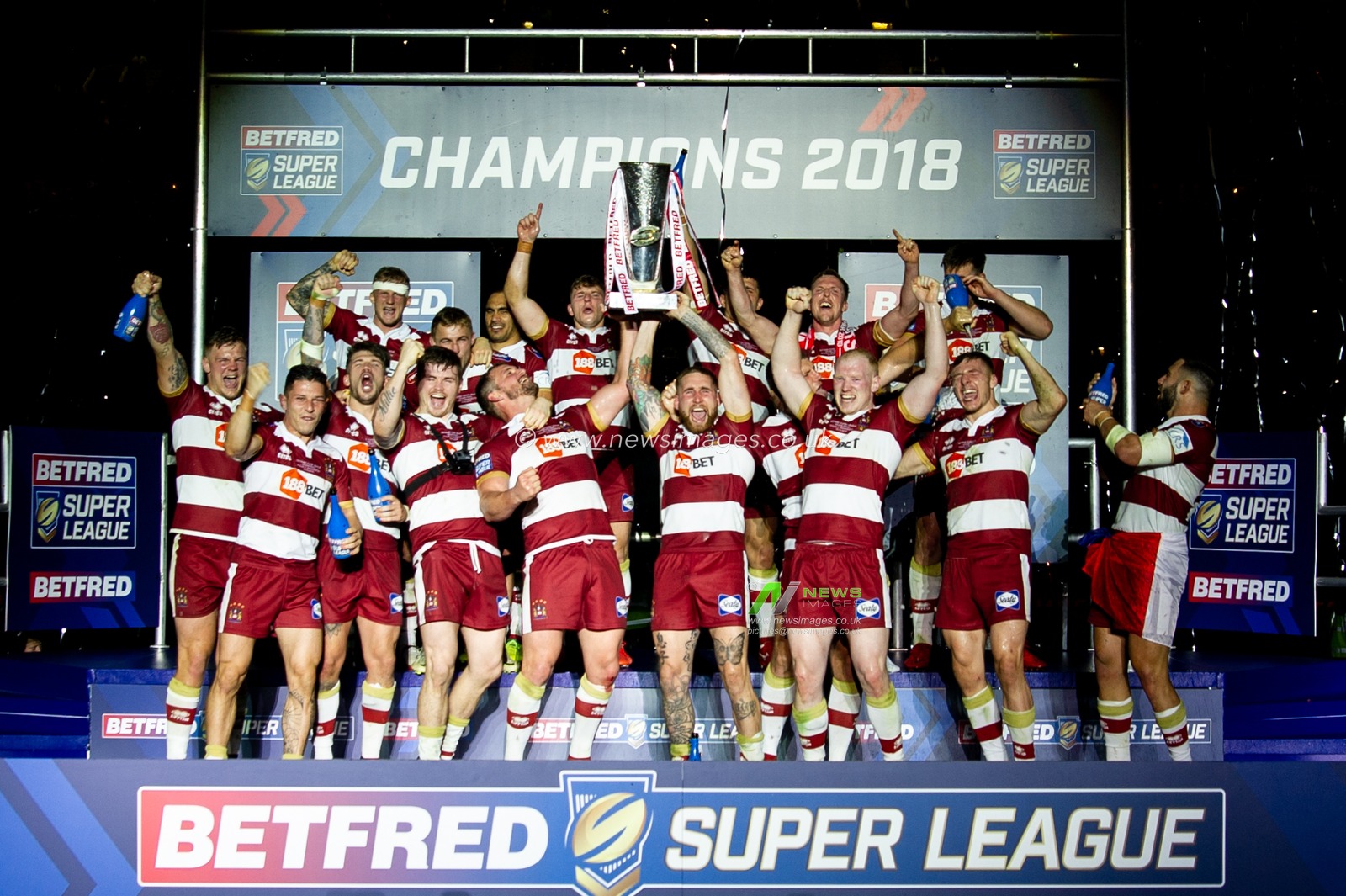 13th October 2018 , Old Trafford,  Manchester, England;  Betfred Super League Grand Final, Wigan Warriors v Warrington Wolves; Sam Tomkins (R) of Wigan Warriors lists the trophy with club captain Sean O'Loughlin (L)


Credit: Richard Long/News Images