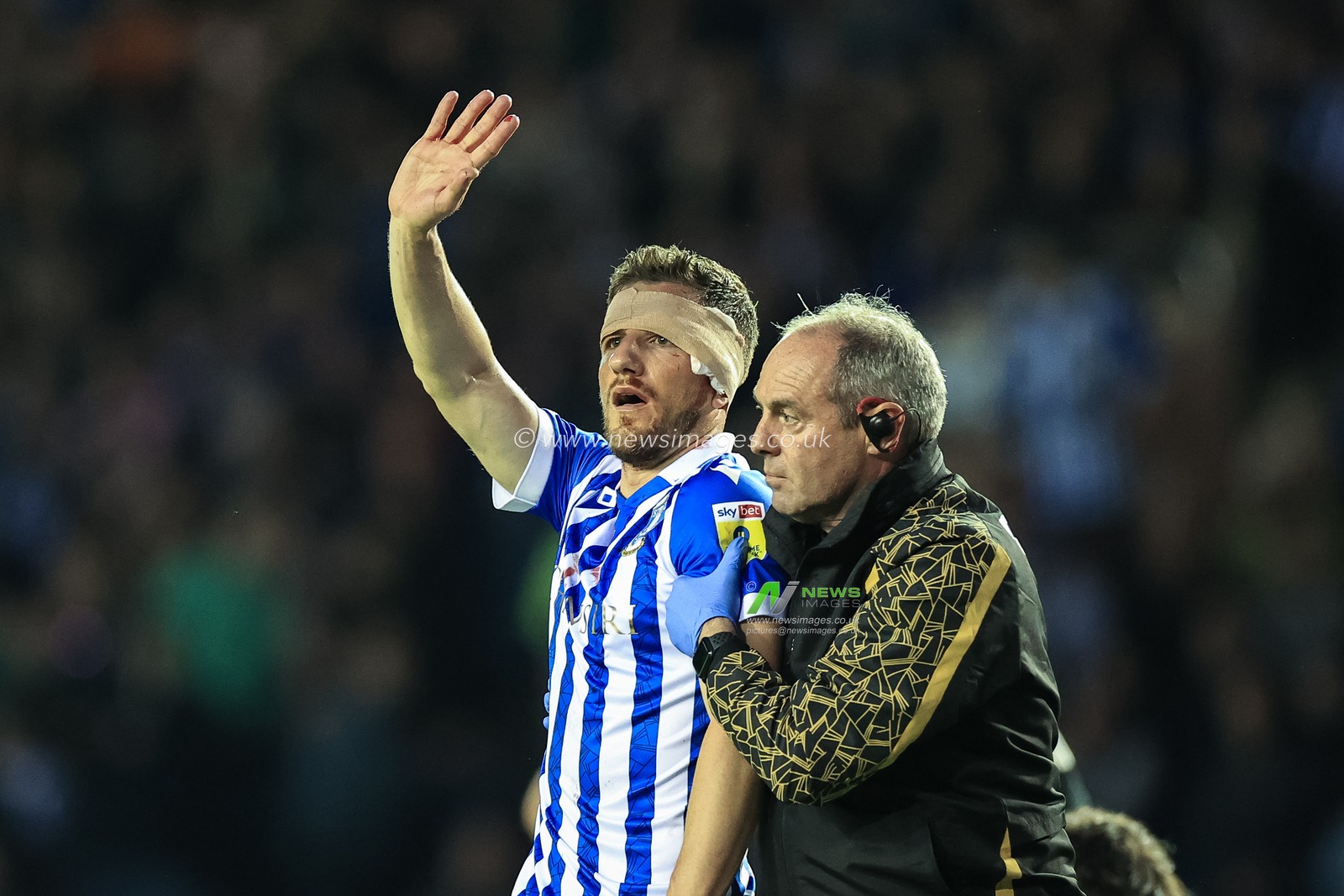 Sam Hutchinson #5 of Sheffield Wednesday waves to the fans as heâ€™s substituted due to a head injury