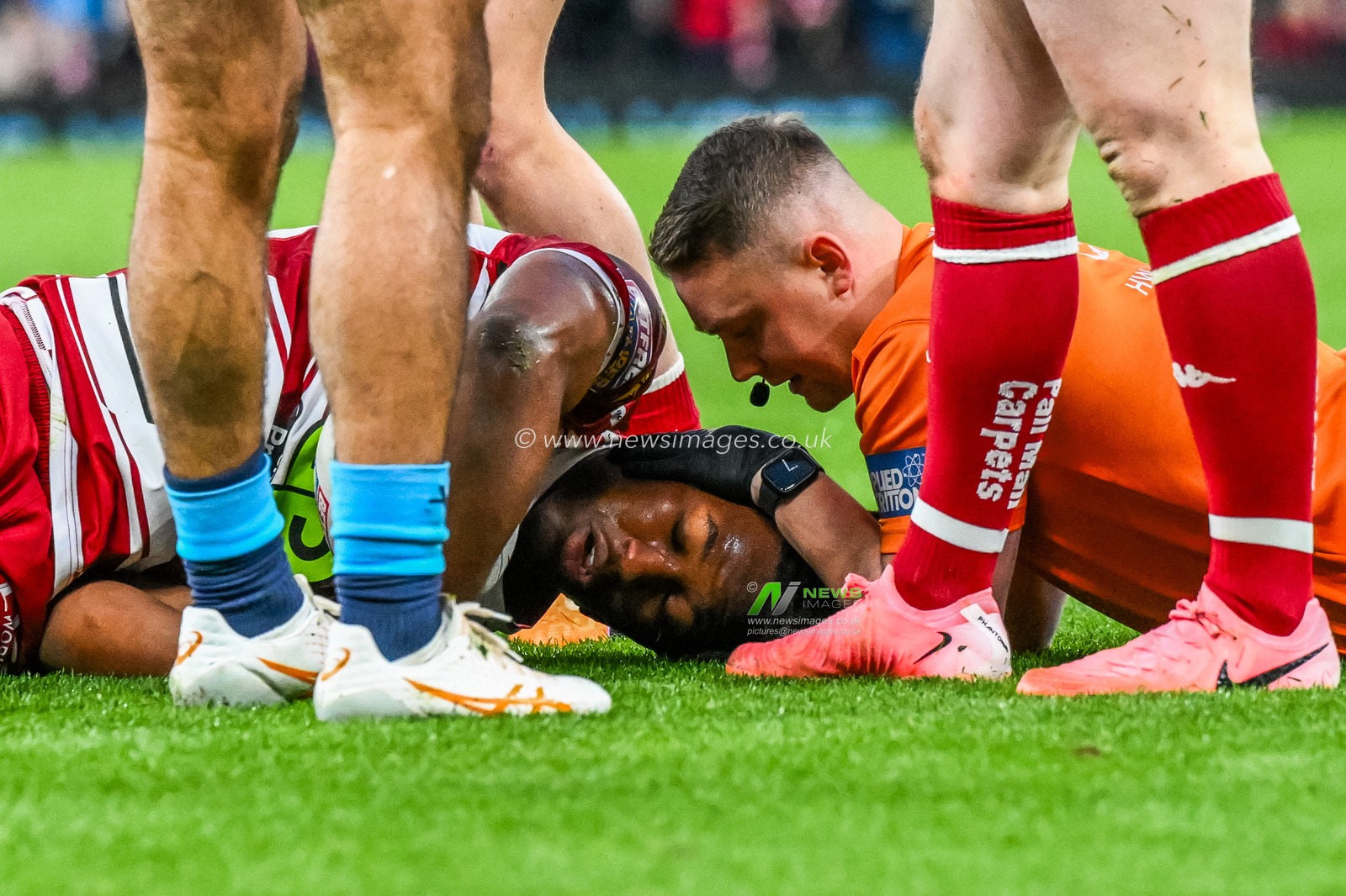 Junior Nsemba of Wigan Warriors goes down with injury during the Betfred Super League Grand Final match Wigan Warriors vs Hull KR at Old Trafford, Manchester, United Kingdom, 12th October 2024

(Photo by Craig Thomas/News Images)