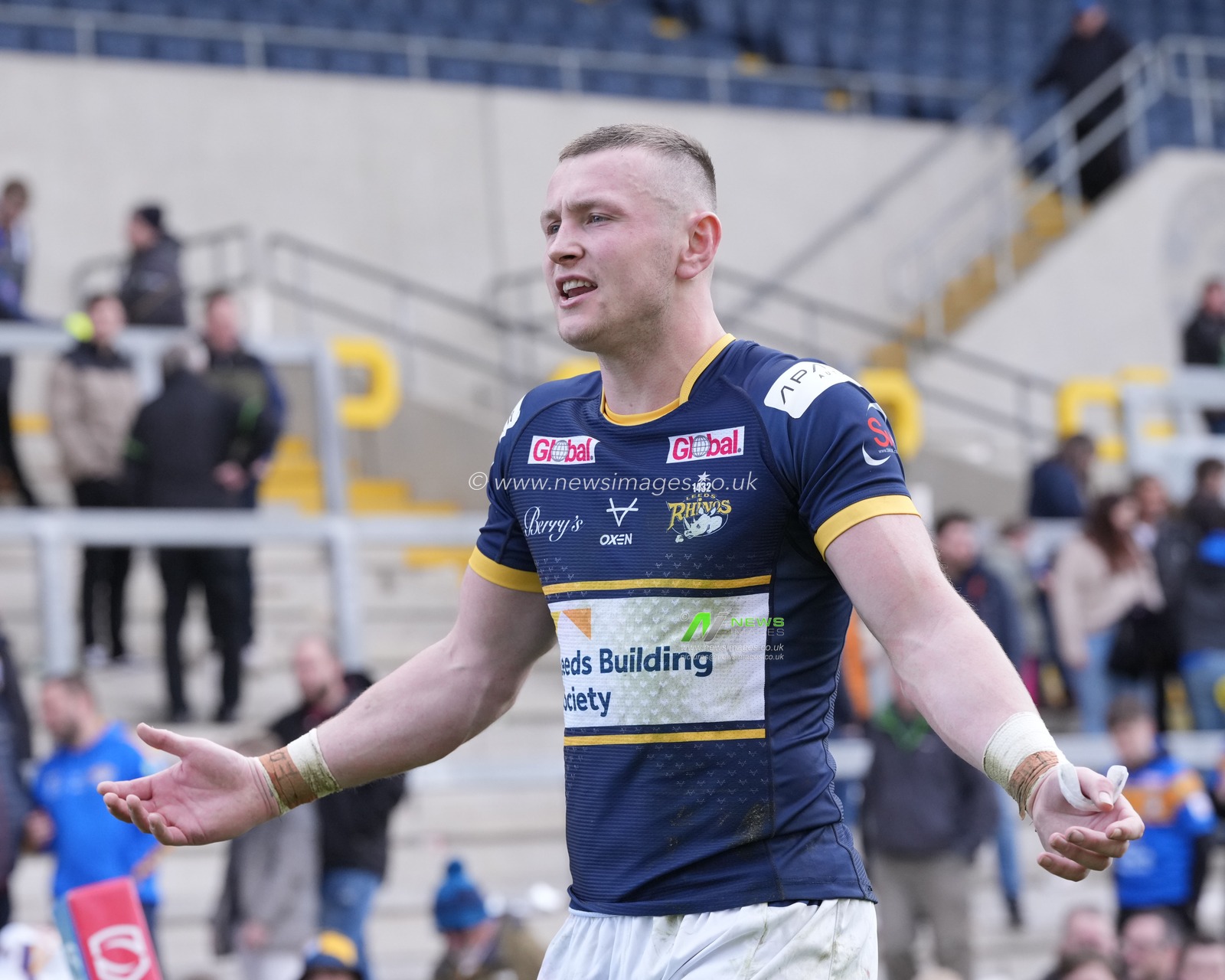 Harry Newman #3 of Leeds Rhinos celebrates with the fans after the Betfred Super League Round 6 match Leeds Rhinos vs Catalans Dragons at Headingley Stadium, Leeds, United Kingdom, 25th March 2023

(Photo by Steve Flynn/News Images)