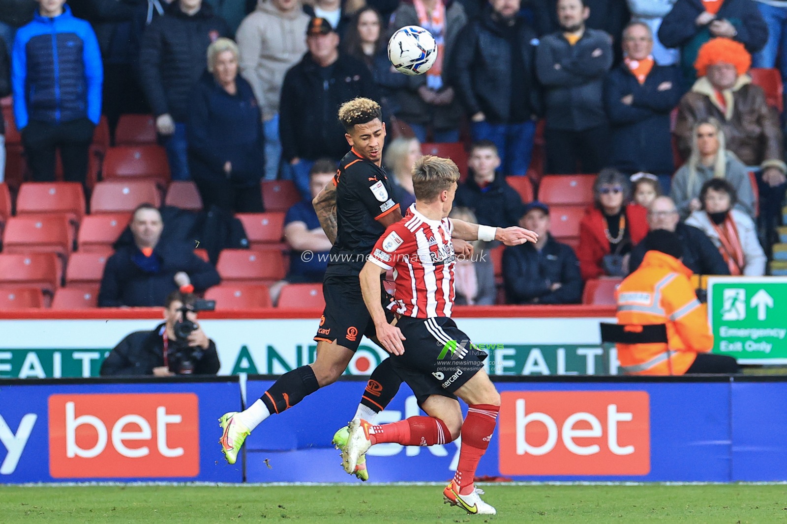 Jordan Gabriel #4 of Blackpool heads clear