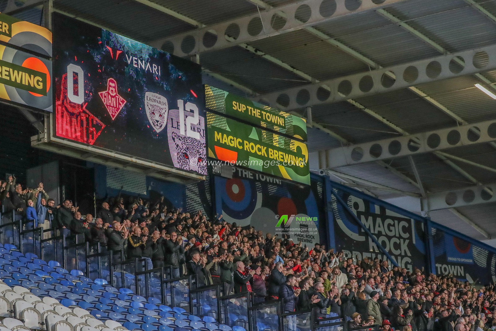 Leigh fans celebrate as they go 0-12 up during the Betfred Super League Round 12 match Huddersfield Giants vs Leigh Leopards at John Smith's Stadium, Huddersfield, United Kingdom, 24th May 2024

(Photo by Alfie Cosgrove/News Images)