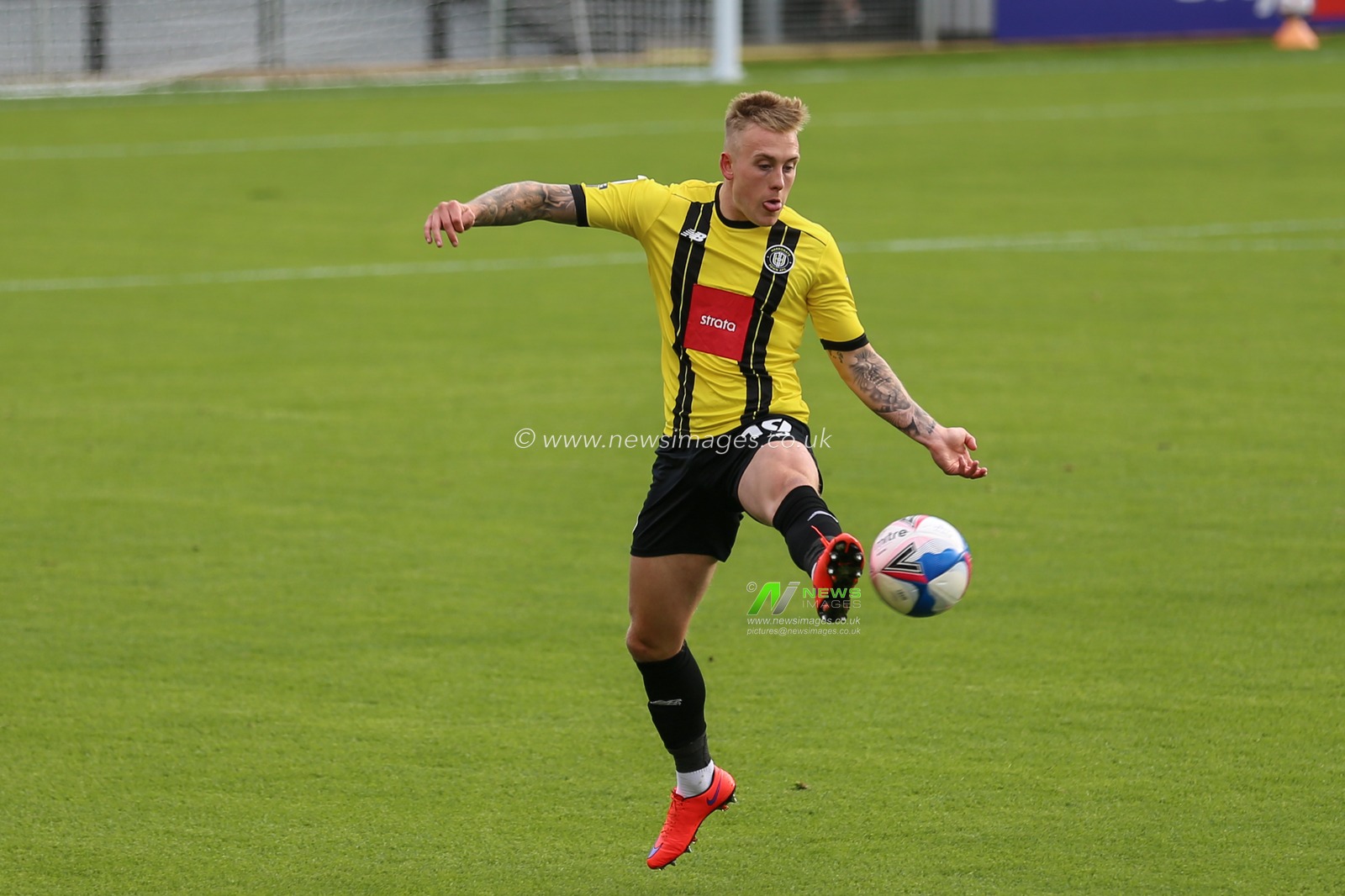 Calvin Miller (19) of Harrogate Town in action during the game