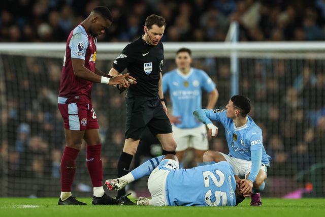 Phil Foden of Manchester City checks on Manuel Akanji of Manchester City as he lies injured during the Premier League match Manchester City vs Aston Villa at Etihad Stadium, Manchester, United Kingdom, 3rd April 2024

(Photo by Mark Cosgrove/News Images)