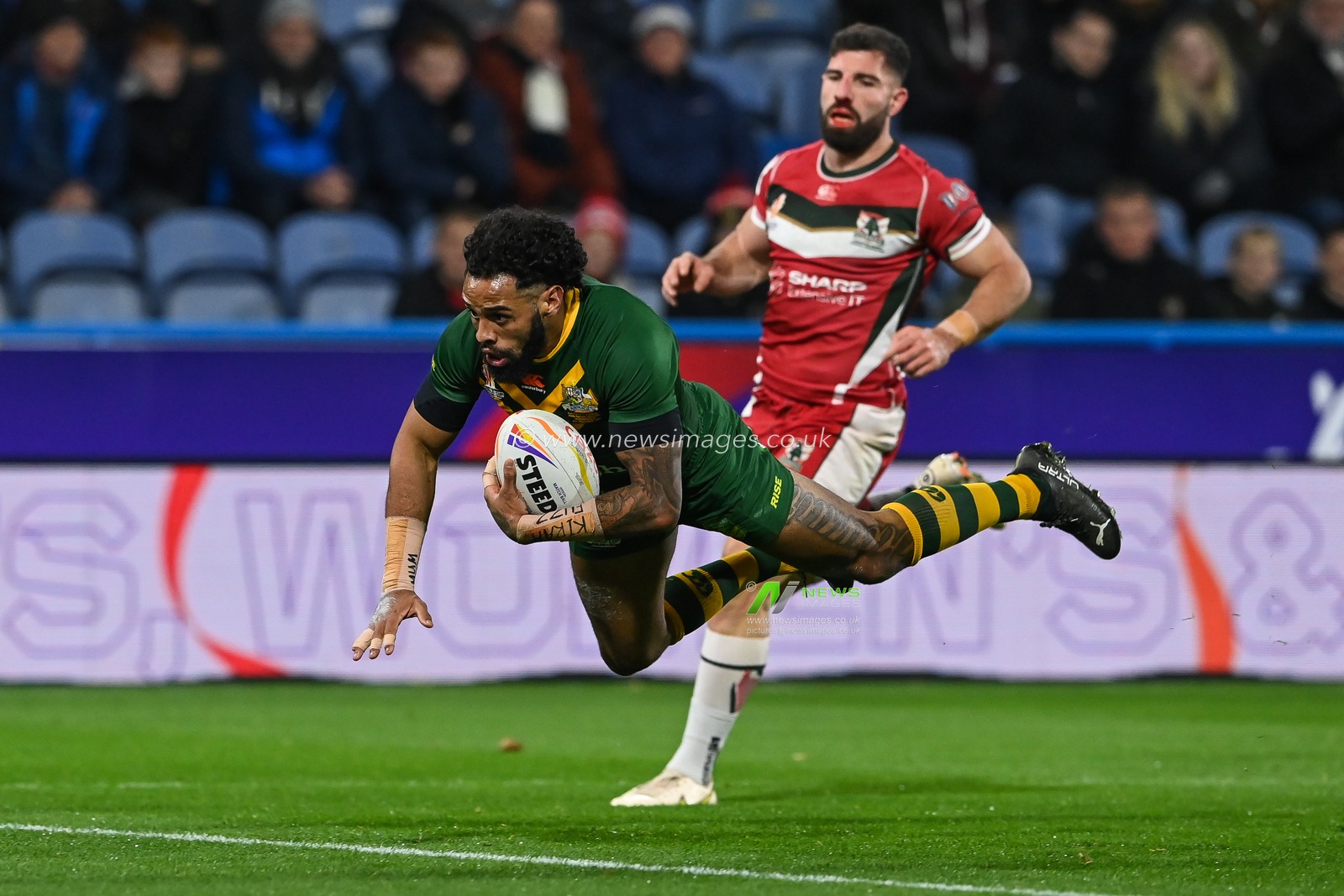 Josh Addo-Carr of Australia goes over for a try during the Rugby League World Cup 2021 Quarter Final match Australia vs Lebanon at John Smith's Stadium, Huddersfield, United Kingdom, 4th November 2022

(Photo by Craig Thomas/News Images)