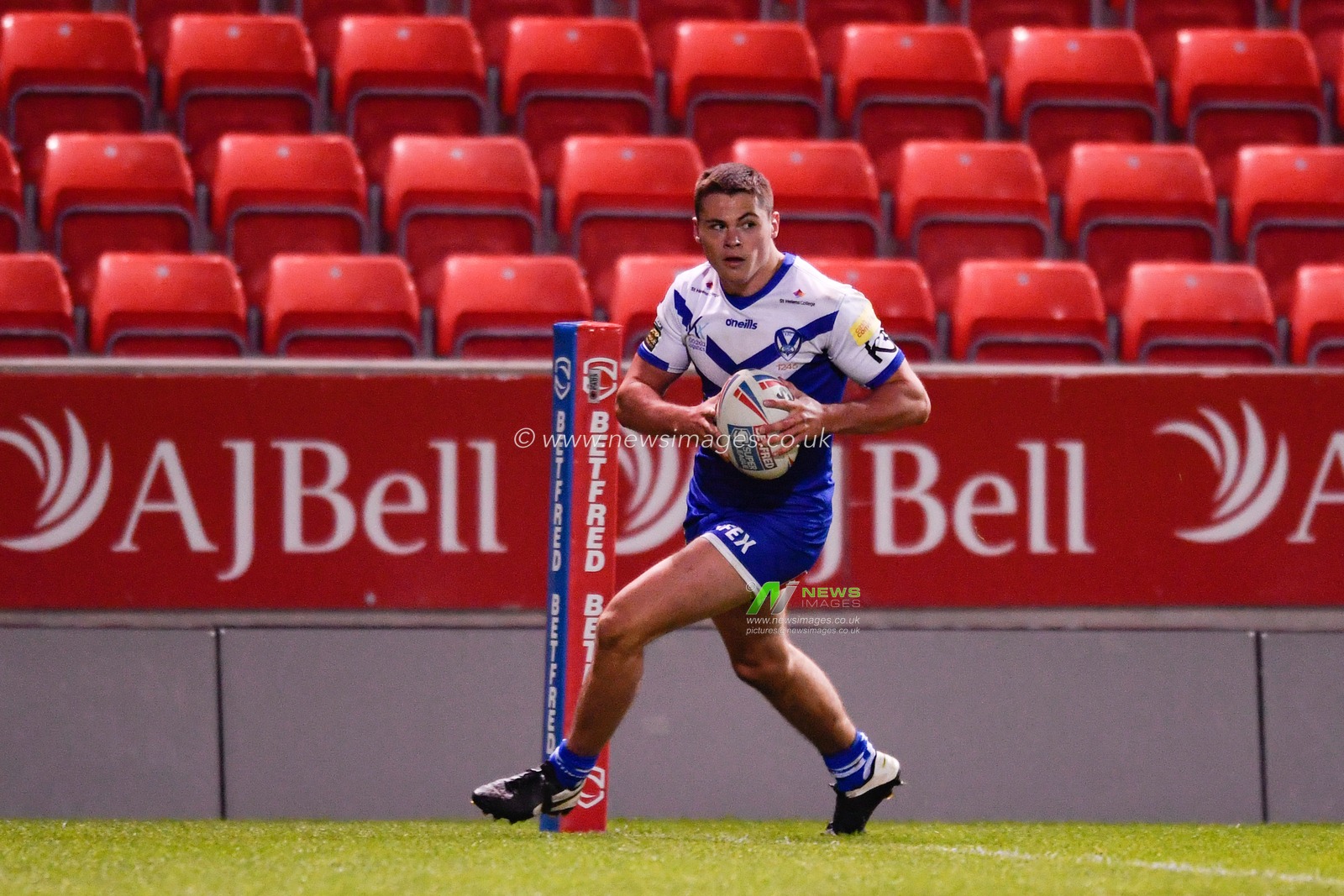 Jack Welsby (22) of St Helens goes over for a try