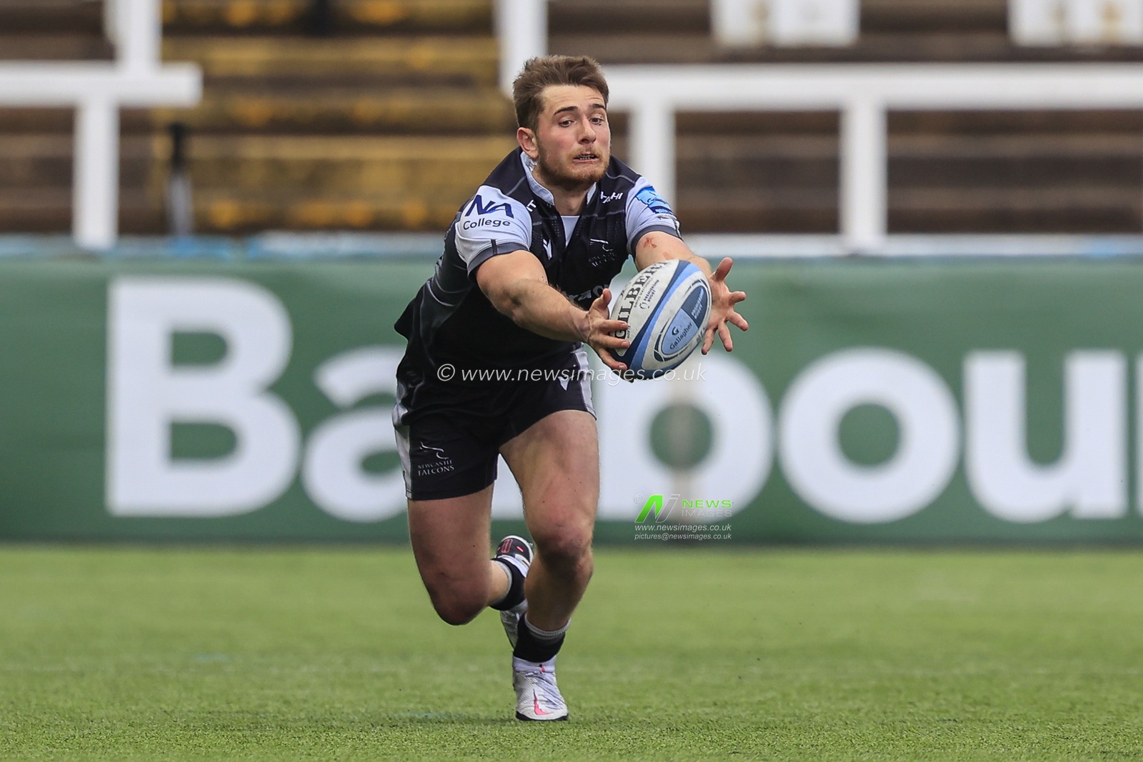 Ben Stevenson of Newcastle Falcons dives forward to catch the ball