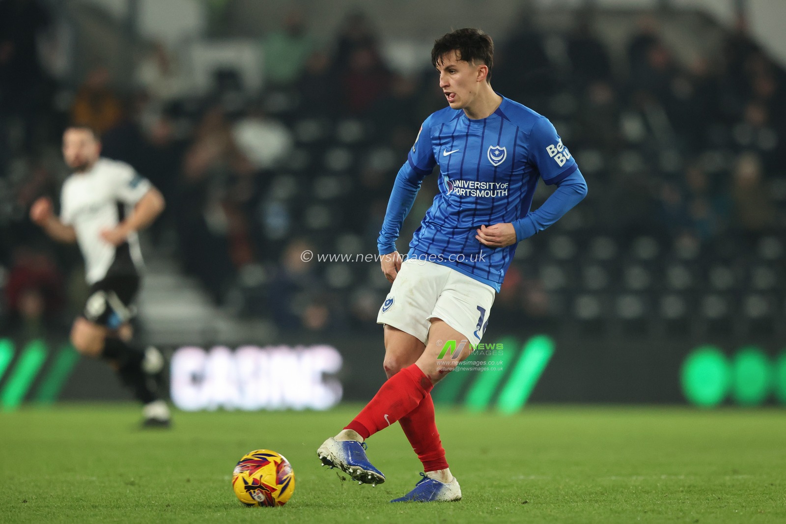 Tom McIntyre of Portsmouth passes the ball during the Sky Bet Championship match Derby County vs Portsmouth at Pride Park Stadium, Derby, United Kingdom, 13th December 2024

(Photo by Alfie Cosgrove/News Images)