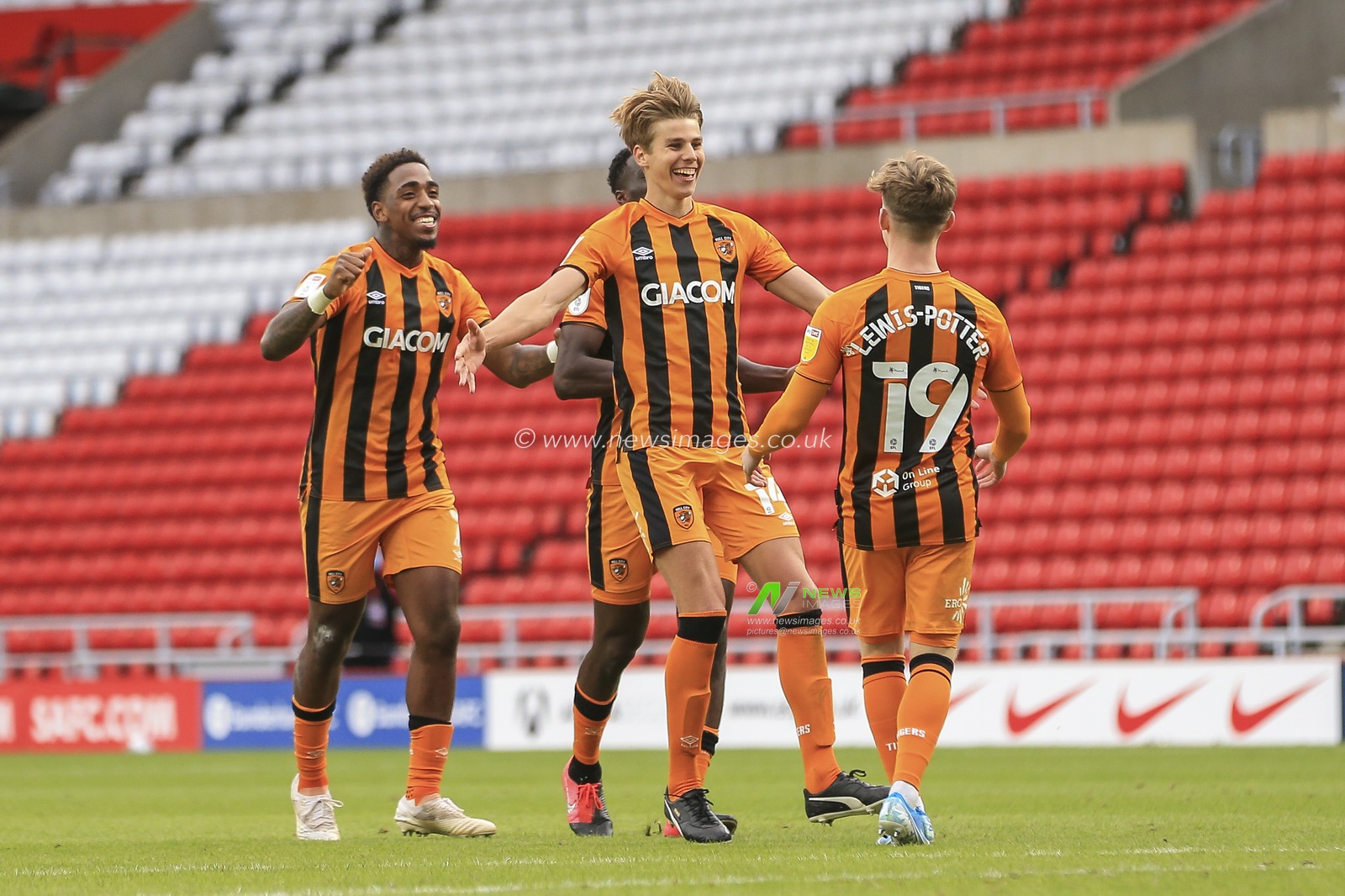 Hull City players celebrate with winning penalty scorer Keane Lewis-Potter (19) of Hull City