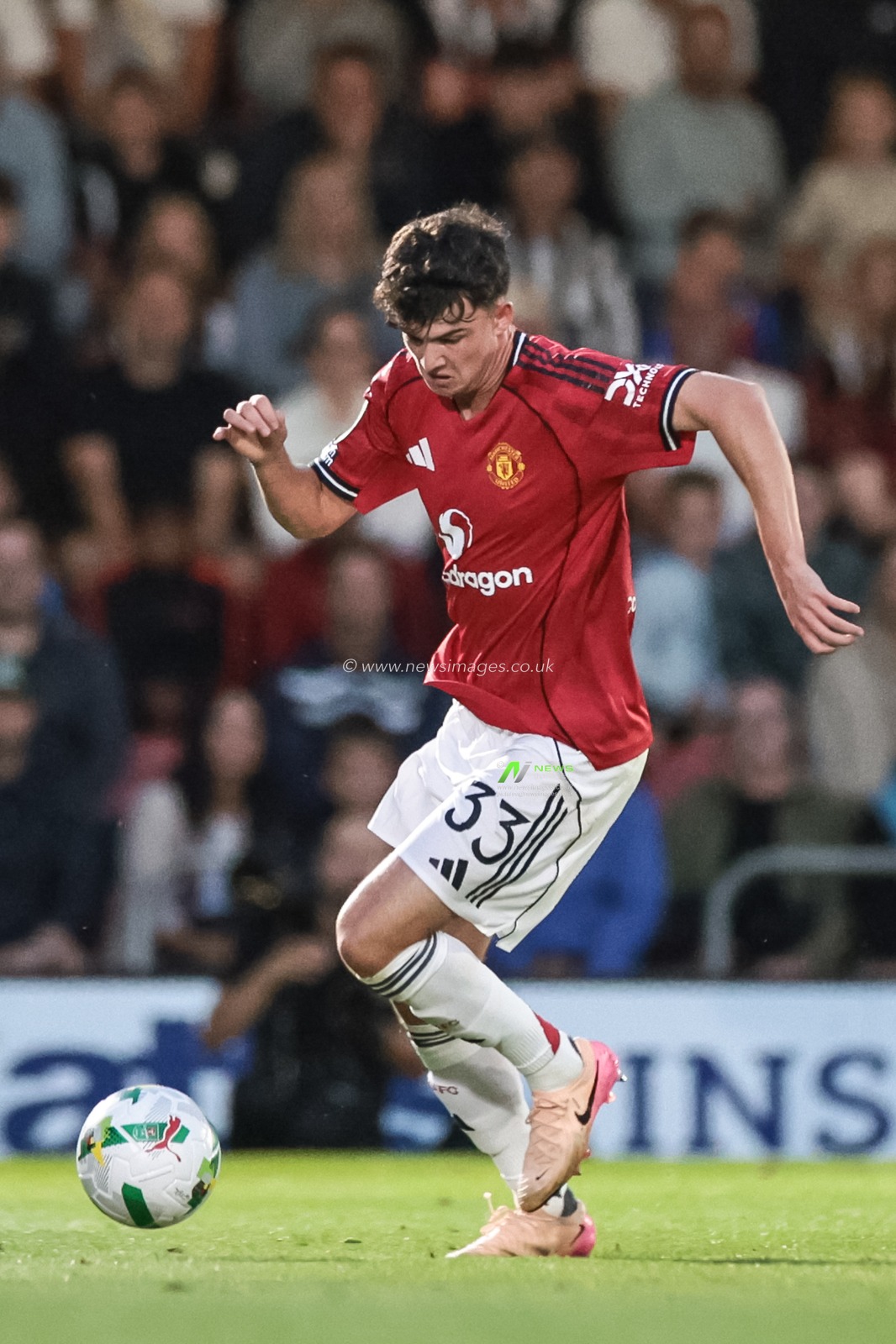 Tyler Fredricson of Manchester United with the ball during the Carabao Cup match Grimsby Town vs Manchester United at Blundell Park, Cleethorpes, United Kingdom, 27th August 2025

(Photo by Mark Cosgrove/News Images)