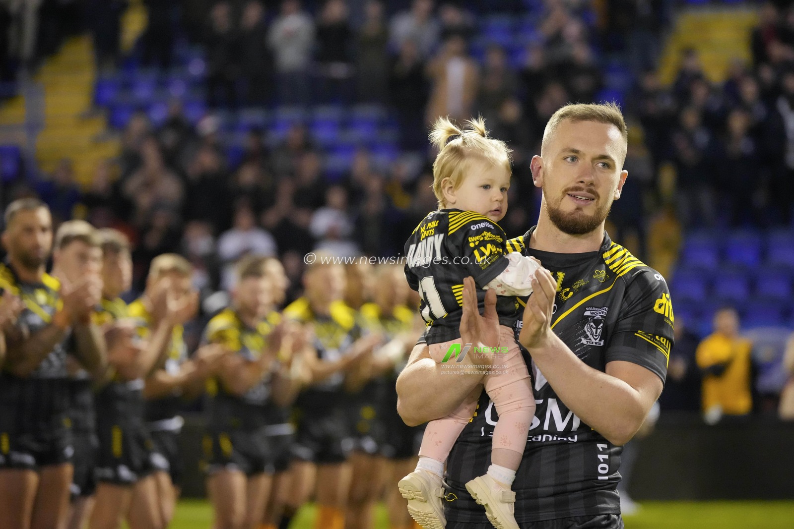Ben Currie #11 of Warrington Wolves  is applauded onto the pitch before the Rugby League Ben Currie Testimonial match Warrington Wolves vs Leigh Leopards at Halliwell Jones Stadium, Warrington, United Kingdom, 4th February 2023

(Photo by Steve Flynn/News Images)