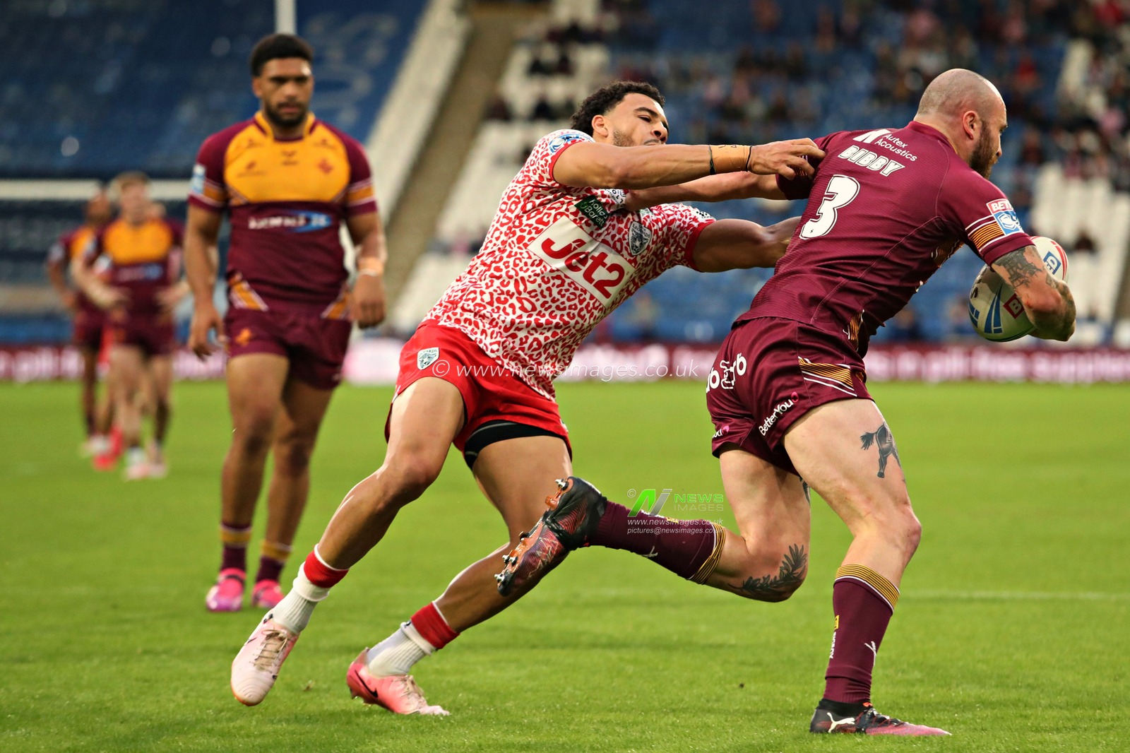 Darnell McIntosh of Leigh Leopards tackles Jake Bibby of Huddersfield Giants during the Betfred Super League Round 13 match Huddersfield Giants vs Leigh Leopards at John Smith's Stadium, Huddersfield, United Kingdom, 29th May 2025(Photo by Sam Eaden/News Images)