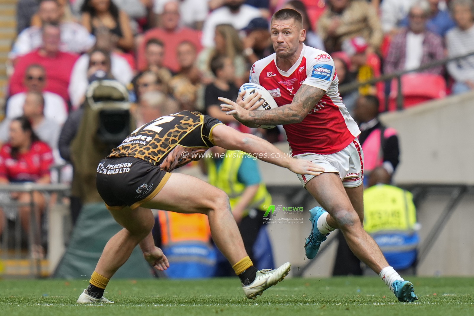 Shaun Kenny-Dowall #4 of Hull KR runs at Jack Hughes #12 of Leigh Leopards during the Betfred Challenge Cup match Hull KR vs Leigh Leopards at Wembley Stadium, London, United Kingdom, 12th August 2023

(Photo by Steve Flynn/News Images)