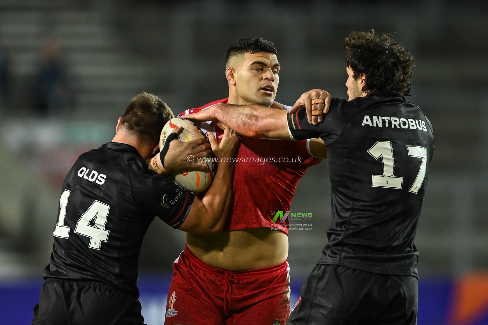 David Fifita of Tonga is tackled by Bailey Antrobus and Ollie Olds of Wales during the Rugby League World Cup 2021 match Tonga vs Wales at Totally Wicked Stadium, St Helens, United Kingdom, 24th October 2022

(Photo by Craig Thomas/News Images)