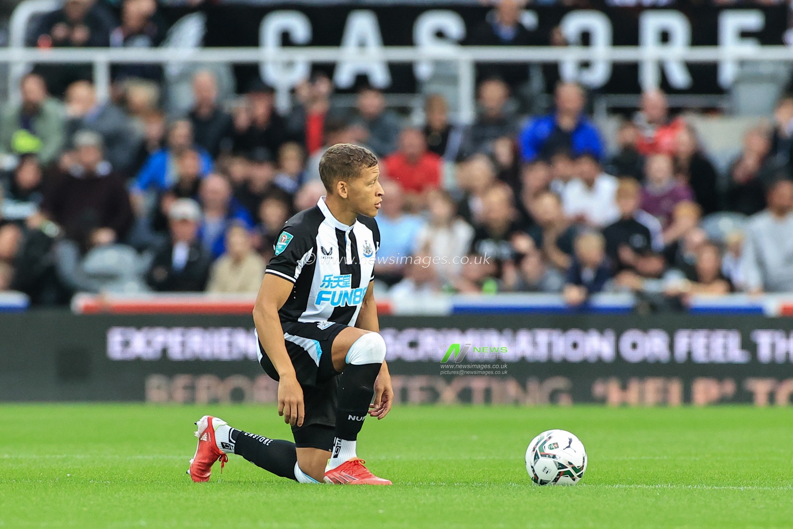 Dwight Gayle #34 of Newcastle United takes the knee