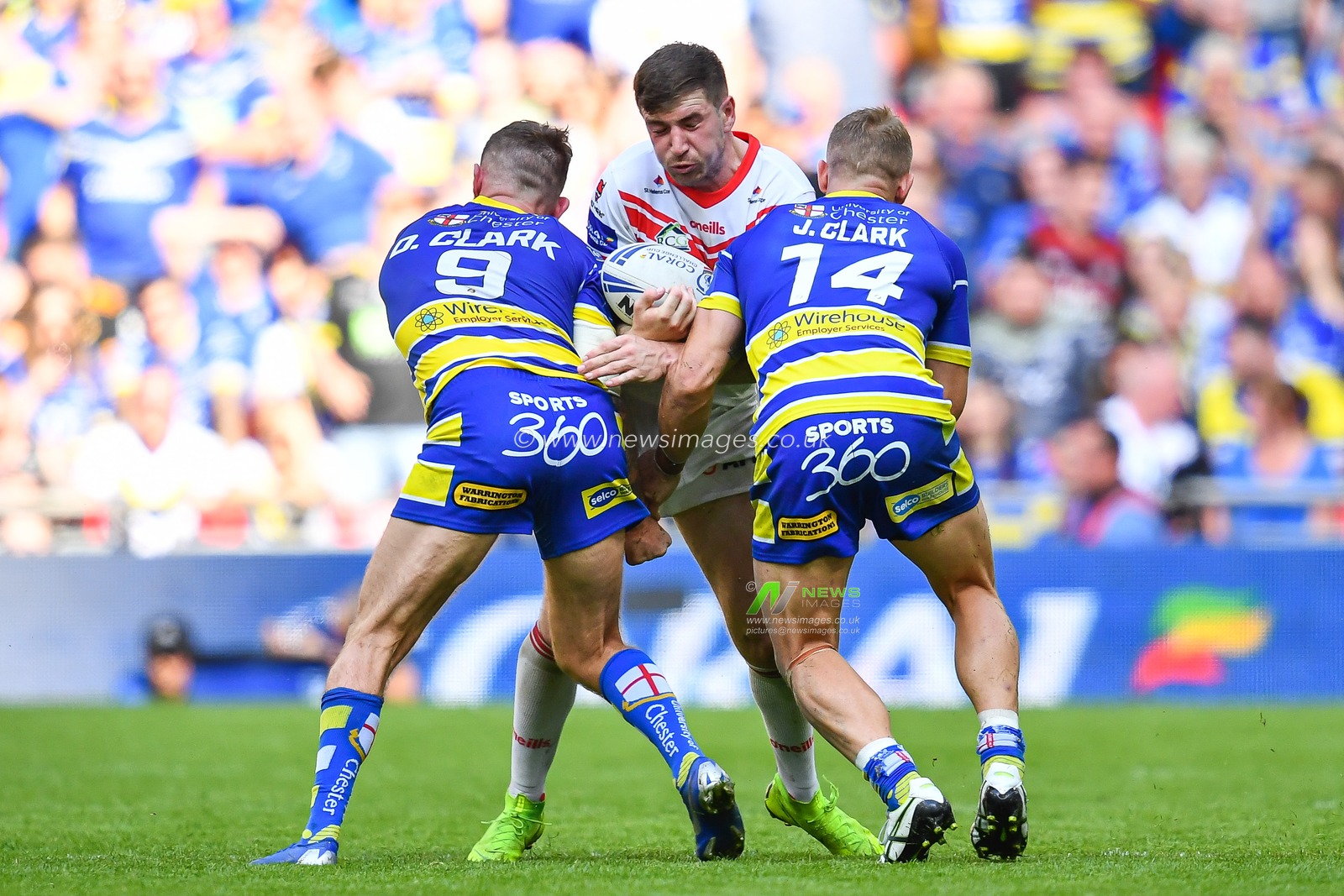 24th August 2019 , Wembley Stadium, London England ; 2019 Coral Challenge Cup Final ; St Helens vs Warrington Wolves ; Mark Percival (4) of St Helens is tackled by Daryl Clark and Jason Clark of Warrington Wolves 



Credit: Craig Thomas/News Images
