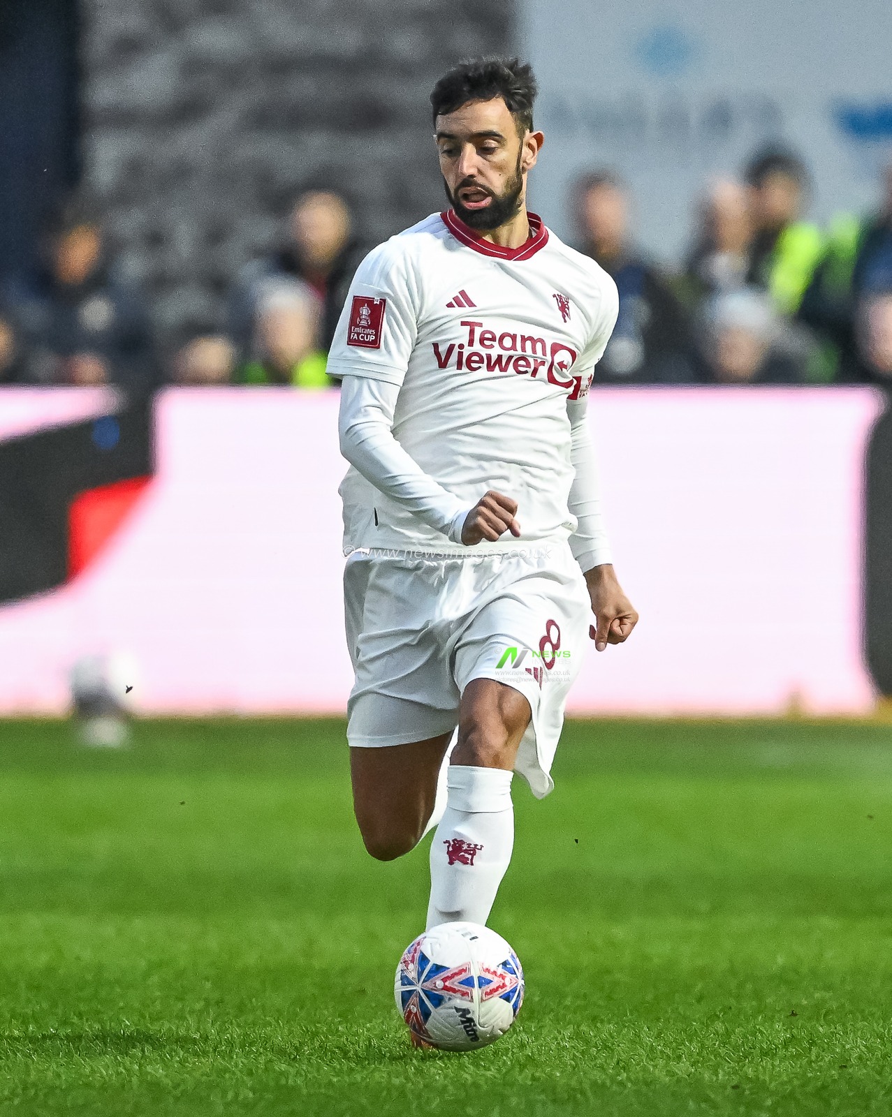 Bruno Fernandes of Manchester United makes a break with the ball during the Emirates FA Cup Fourth Round match Newport County vs Manchester United at Rodney Parade, Newport, United Kingdom, 28th January 2024

(Photo by Craig Thomas/News Images)