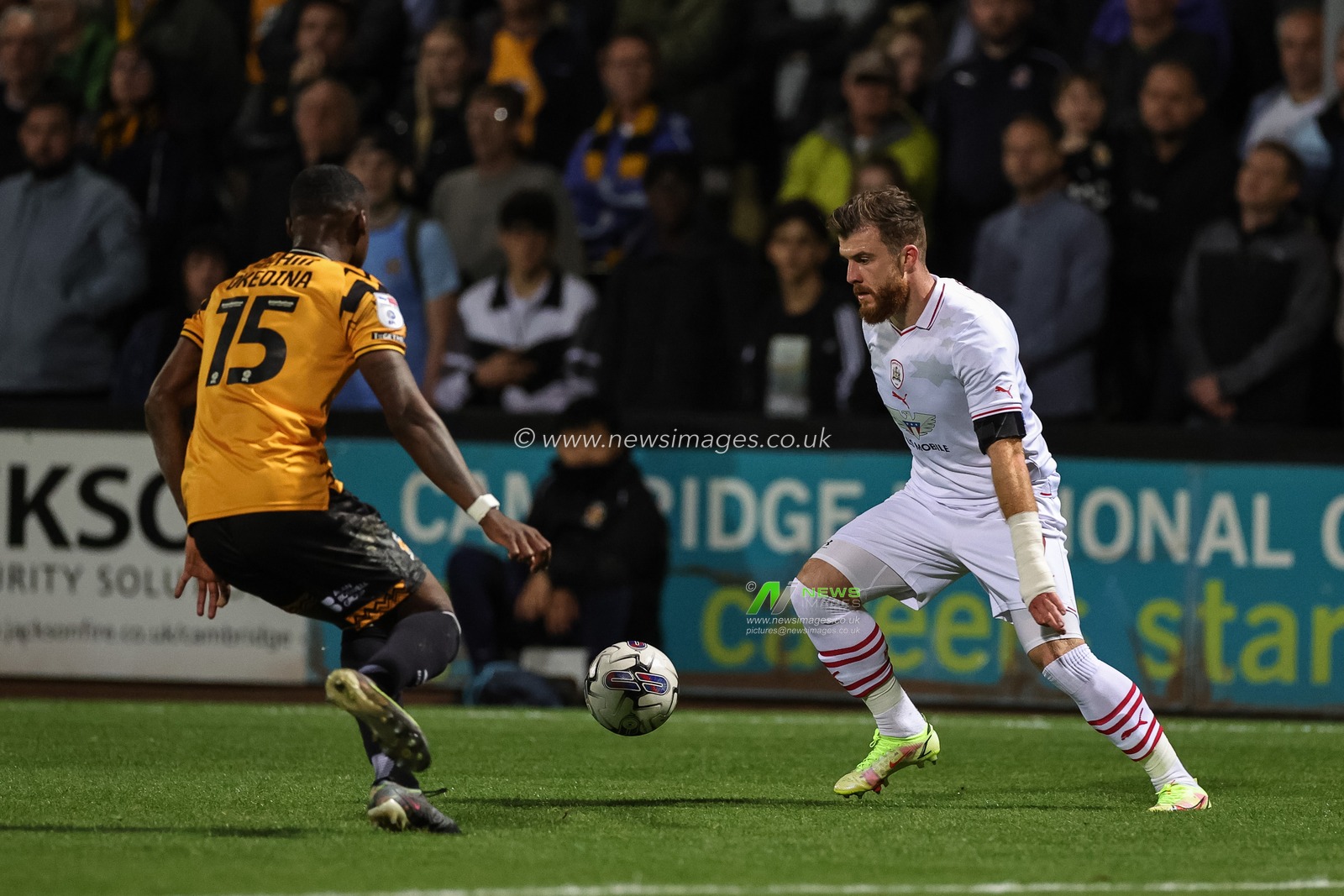 Nicky Cadden #7 of Barnsley holds the ball as Jubril Okedina #15 of Cambridge United tracks him during the Sky Bet League 1 match Cambridge United vs Barnsley at Abbey Stadium, Cambridge, United Kingdom, 3rd October 2023

(Photo by Mark Cosgrove/News Images)