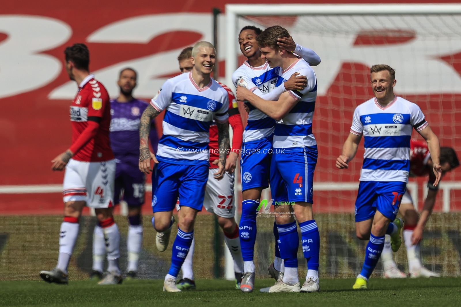 Rob Dickie #4 of Queens Park Rangers celebrates his goal with his teammates to make it 0-1