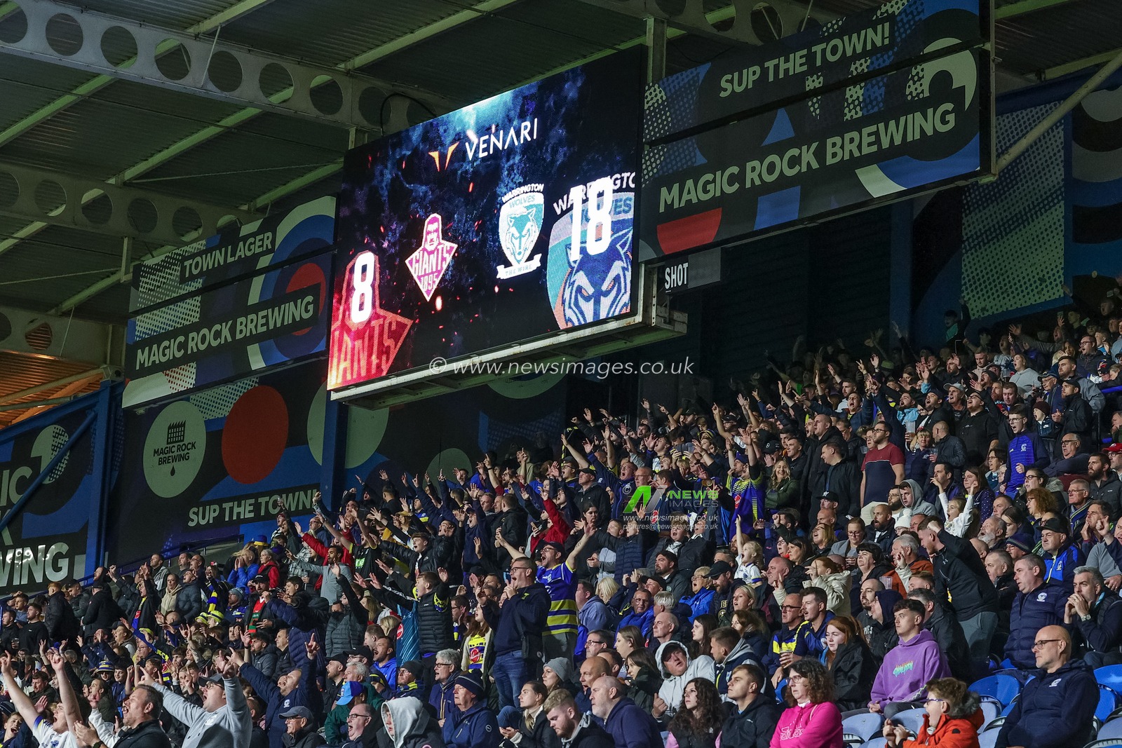 Warrington fans celebrate as they go 8-18 up during the Betfred Super League Round 27 match Huddersfield Giants vs Warrington Wolves at John Smith's Stadium, Huddersfield, United Kingdom, 22nd September 2023

(Photo by Mark Cosgrove/News Images)