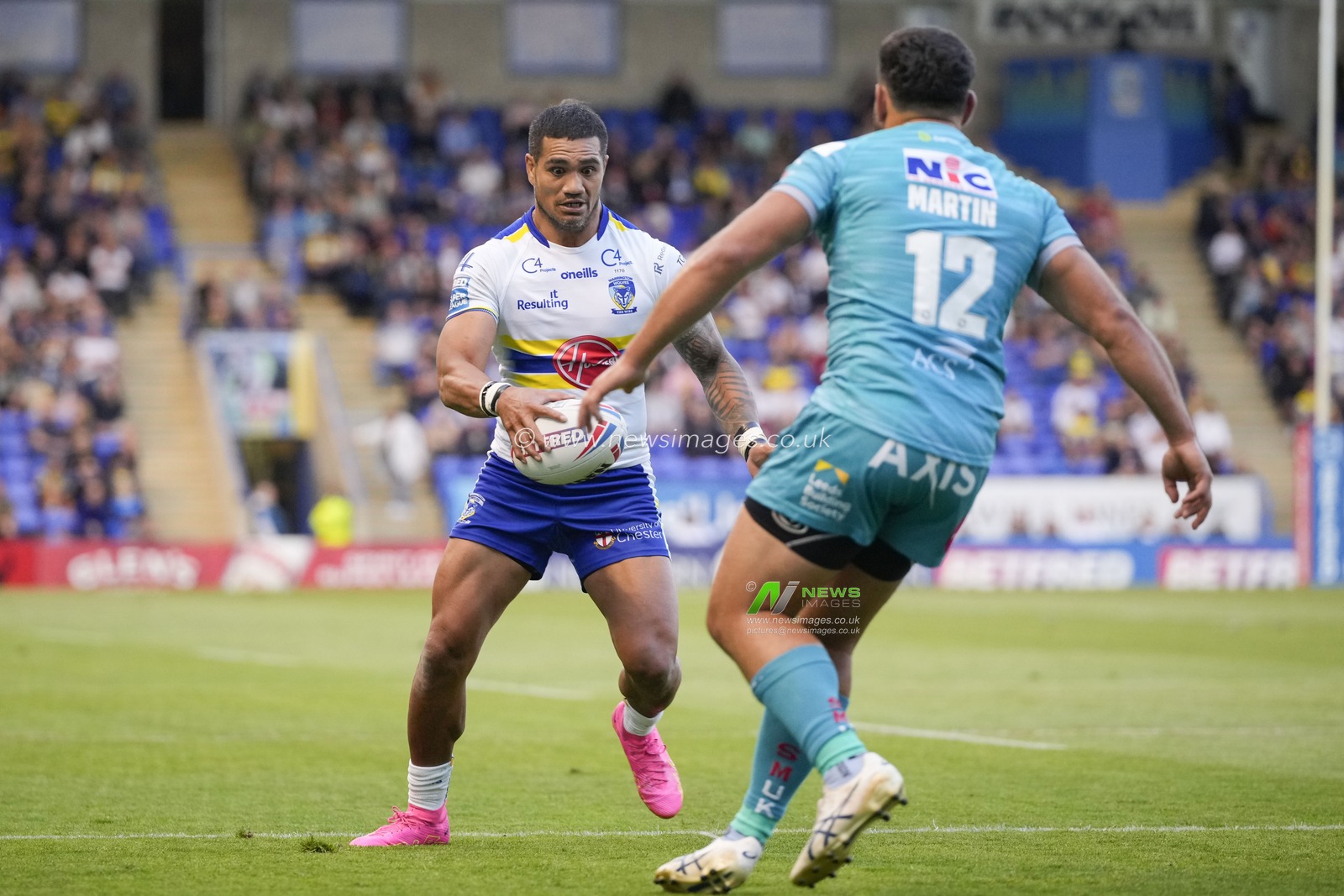Pete Mataâ€™utia #3 of Warrington Wolves runs at Rhyse Martin #12 of Leeds Rhinos during the Betfred Super League Round 17 match Warrington Wolves vs Leeds Rhinos at Halliwell Jones Stadium, Warrington, United Kingdom, 29th June 2023

(Photo by Steve Flynn/News Images)