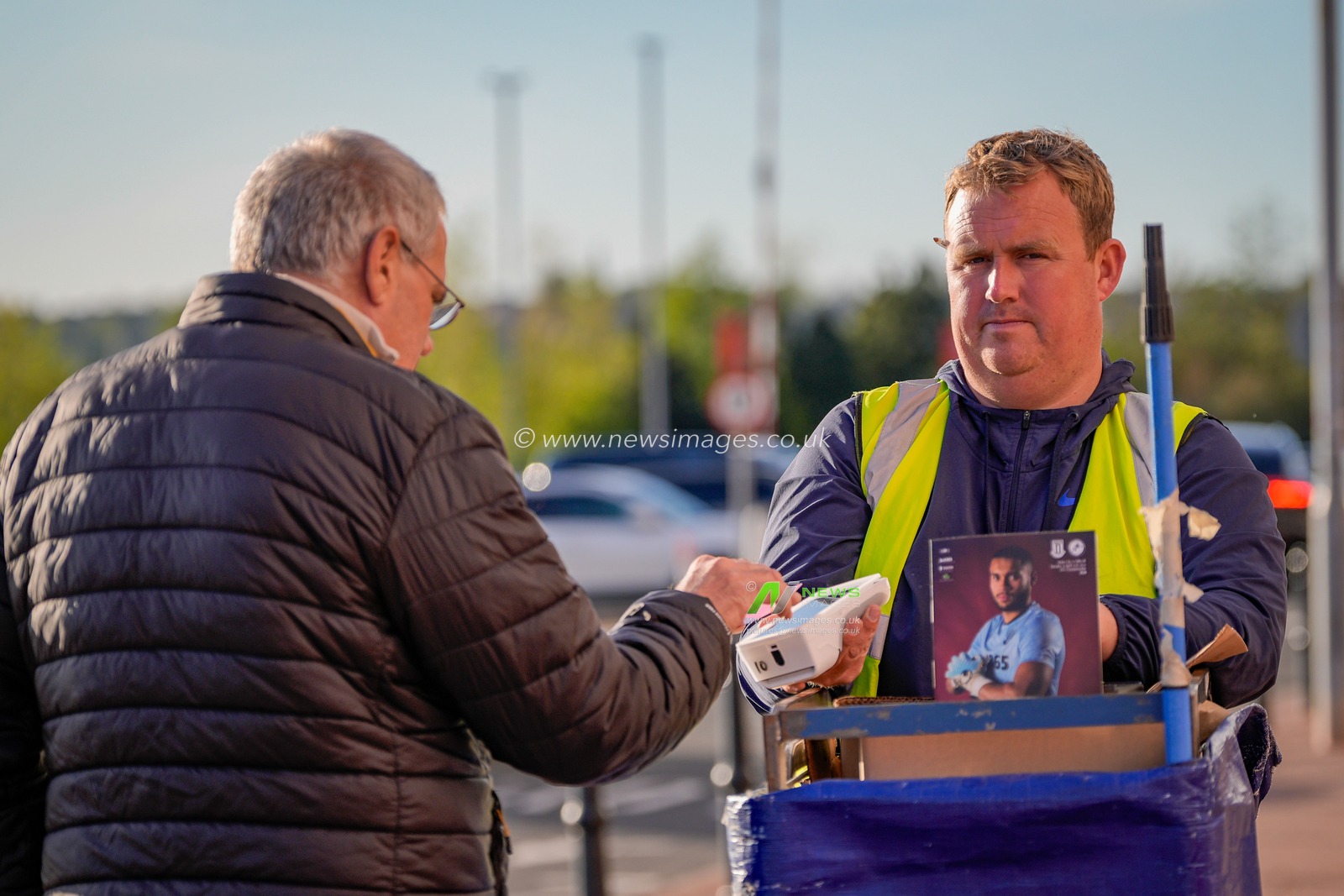 Stoke City fan buys a program outside the stadium during the Sky Bet Championship match Stoke City vs Millwall at Bet365 Stadium, Stoke On Trent, United Kingdom on 21 April 2026

(Photo by Maynard Manyowa/News Images)