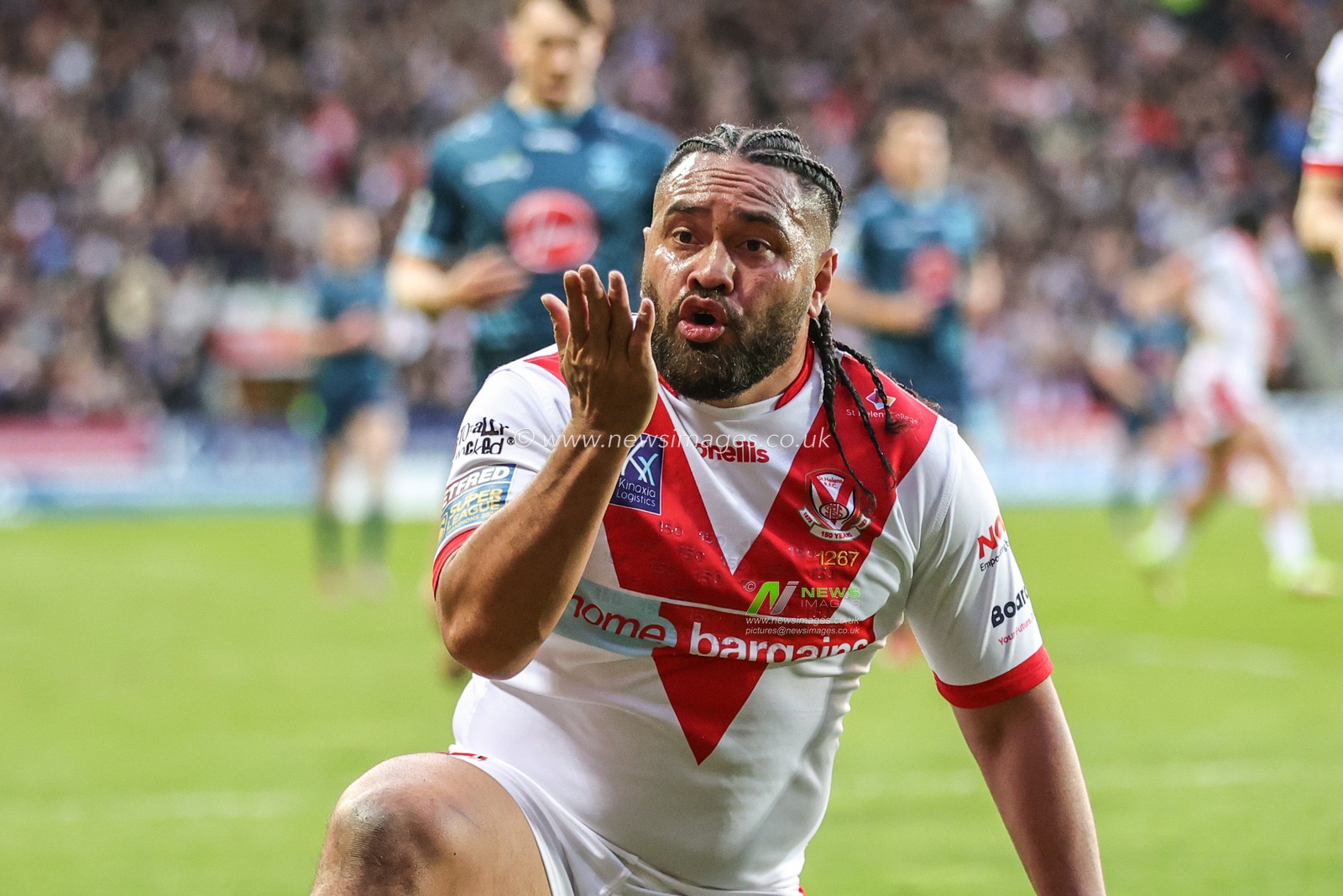Konrad Hurrell #23 of St Helens blows a kiss as he celebrates his try during the Betfred Super League Round 10 match St Helens vs Warrington Wolves at Totally Wicked Stadium, St Helens, United Kingdom, 20th April 2023

(Photo by Mark Cosgrove/News Images)