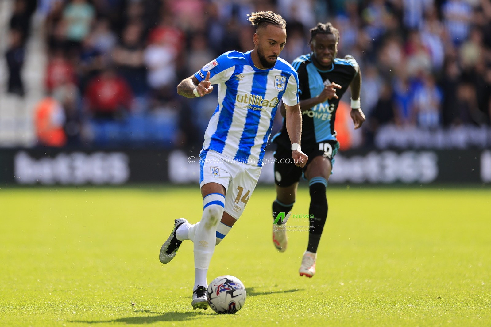 Sorba Thomas #14 of Huddersfield Town runs with the ball during the Sky Bet Championship match Huddersfield Town vs Leicester City at John Smith's Stadium, Huddersfield, United Kingdom, 12th August 2023

(Photo by Conor Molloy/News Images)