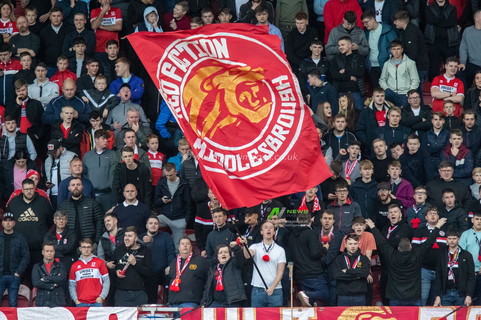 Red Faction Middlesbrough supporters wave their flags during the Sky Bet Championship match Middlesbrough vs Huddersfield Town at Riverside Stadium, Middlesbrough, United Kingdom, 22nd October 2022

(Photo by James Heaton/News Images)