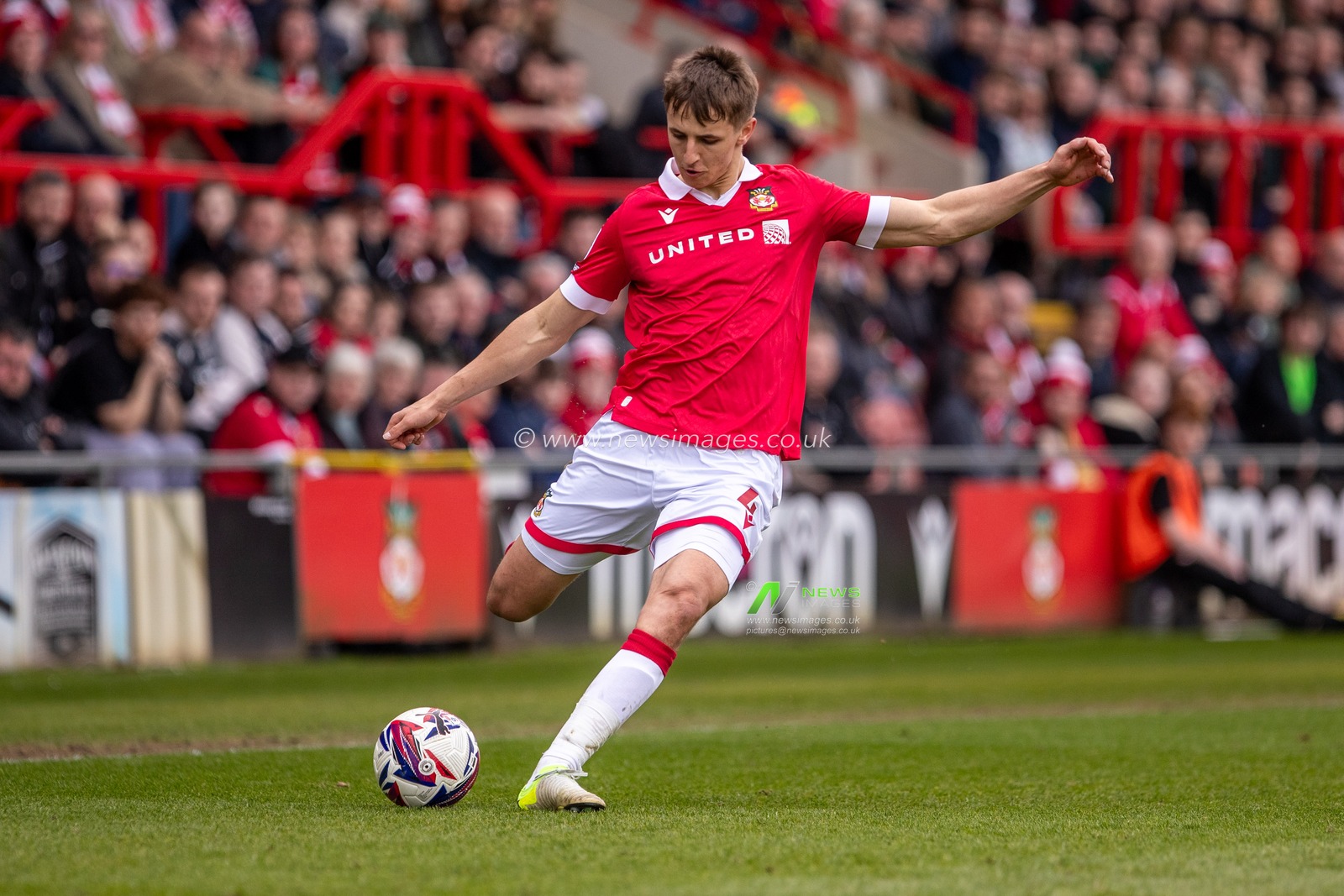 Wrexham's Max Cleworth crosses the ball during the Sky Bet League 1 match Wrexham vs Stockport County at SToK Cae Ras, Wrexham, United Kingdom, 22nd March 2025

(Photo by Nik Mesney/News Images)