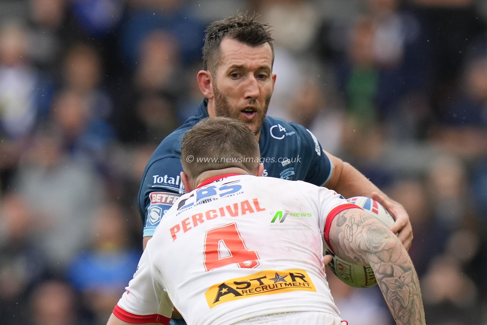 Stefan Ratchford #4 of Warrington Wolves runs at Mark Percival #4 of St. Helens during the Betfred Super League Eliminator match St Helens vs Warrington Wolves at Totally Wicked Stadium, St Helens, United Kingdom, 30th September 2023

(Photo by Steve Flynn/News Images)