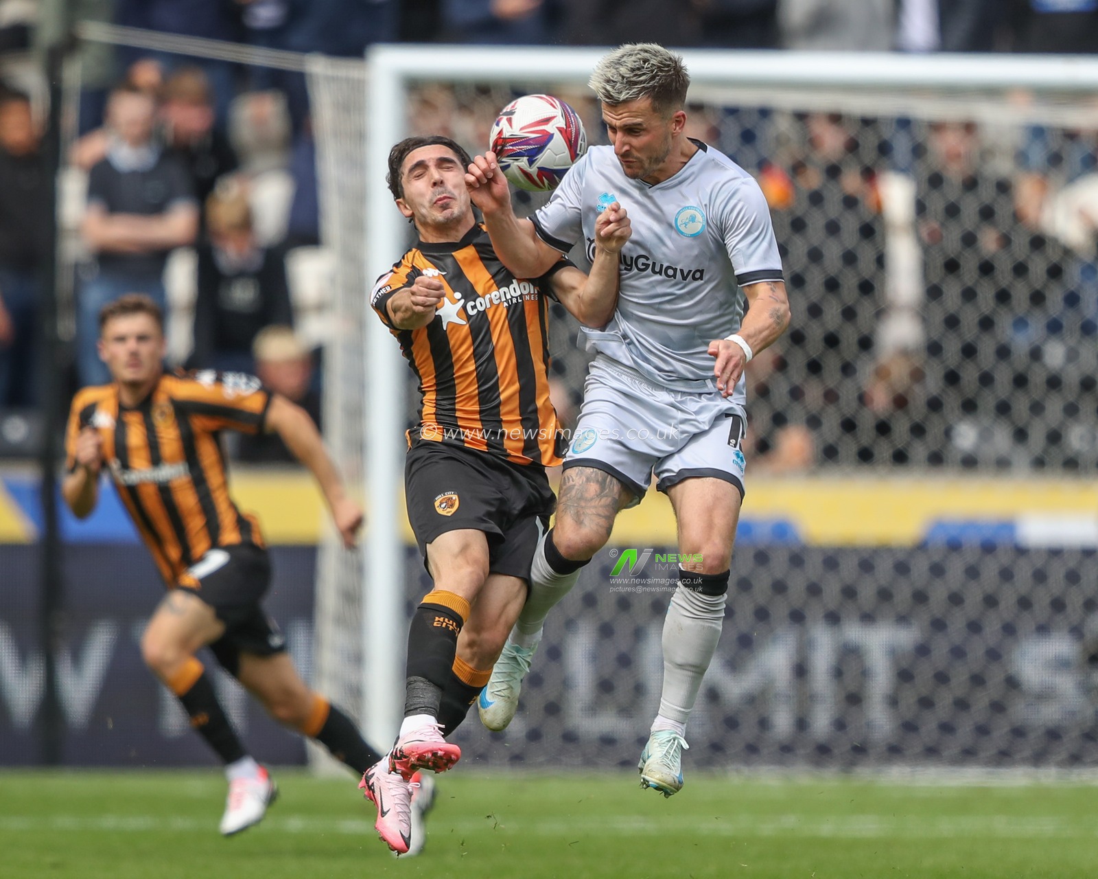 AbdÃ¼lkadir Ã–mÃ¼r of Hull City is fouled by Joe Bryan of Millwall during the Sky Bet Championship match Hull City vs Millwall at MKM Stadium, Hull, United Kingdom, 24th August 2024

(Photo by Alfie Cosgrove/News Images)