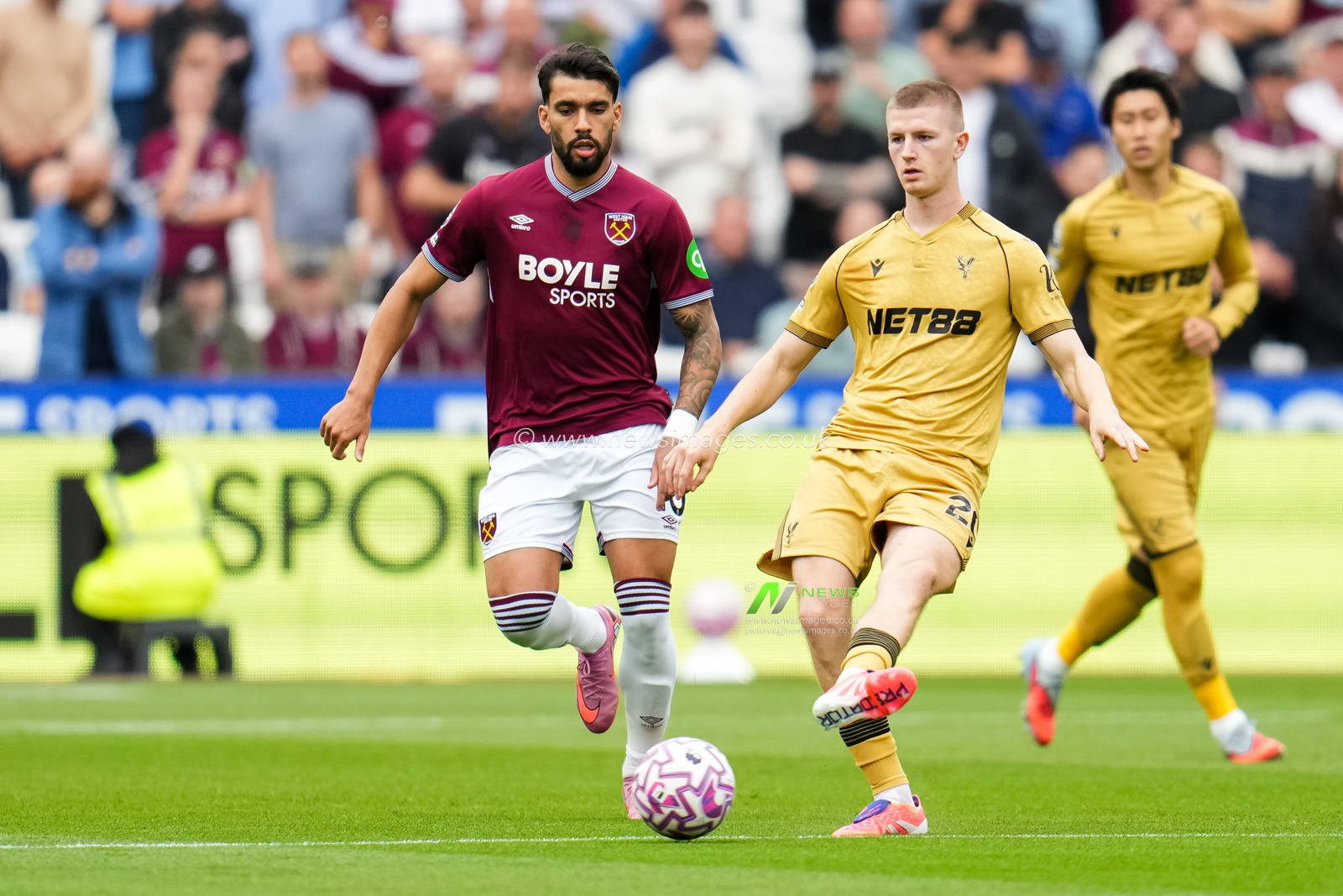 Adam Wharton of Crystal Palace plays the ball under pressure from Lucas Paqueta of West Ham United during the Premier League match West Ham United vs Crystal Palace at London Stadium, London, United Kingdom, 20th September 2025

(Photo by Harvey Murphy/News Images)