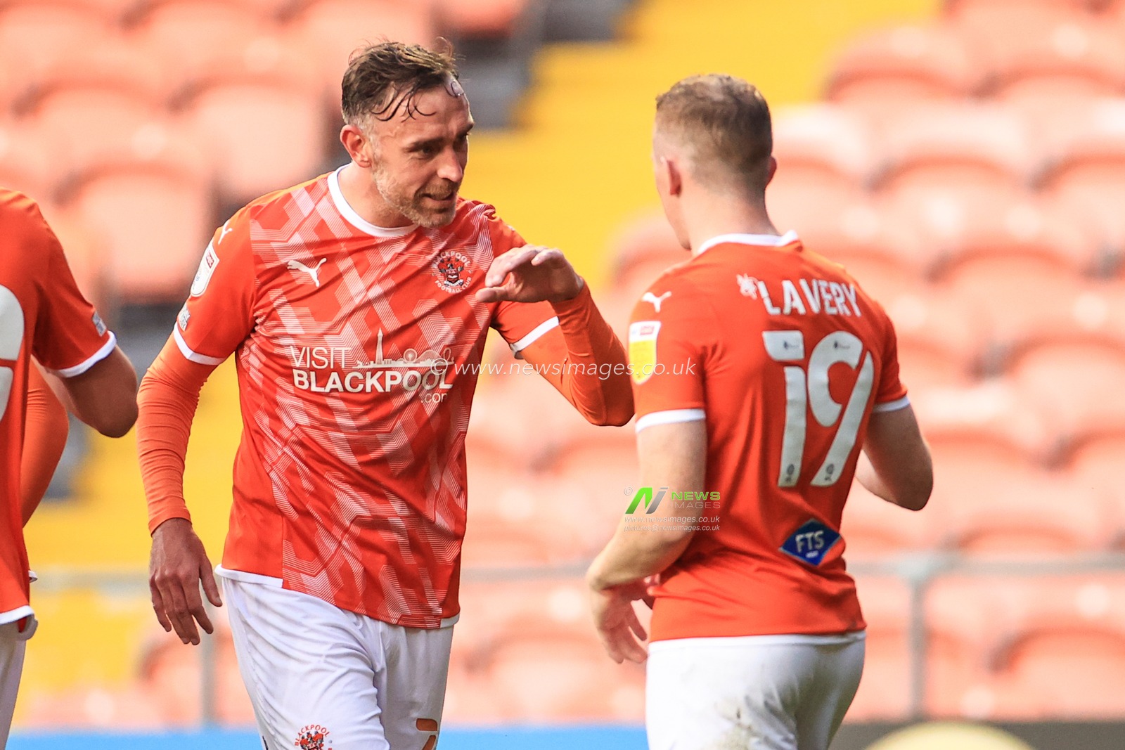 Shayne Lavery #19 of Blackpool celebrates his goal to make it 1-0 with Richard Keogh #26 of Blackpool