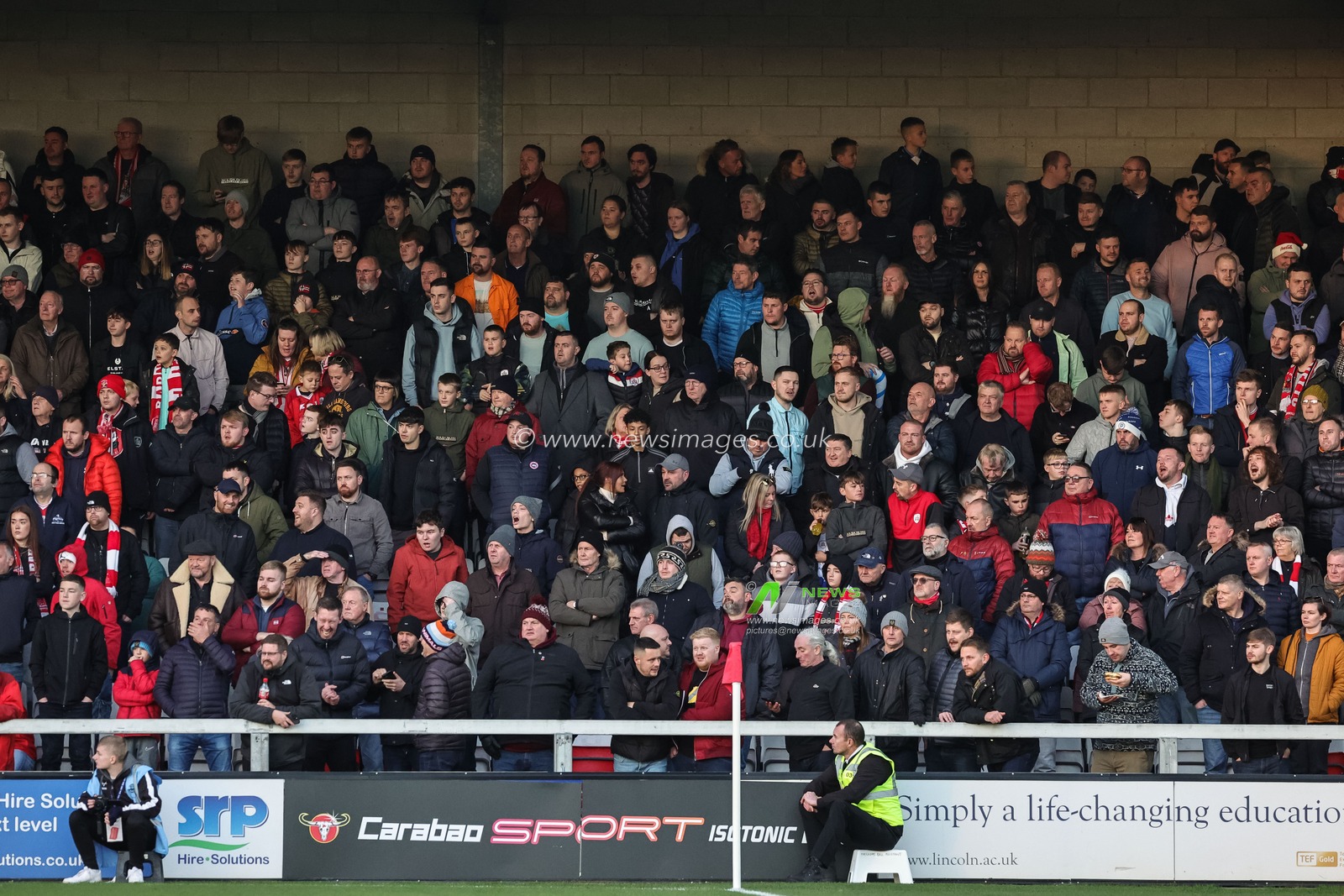 Traveling Barnsley fans during the Sky Bet League 1 match Lincoln City vs Barnsley at Gelder Group Sincil Bank Stadium, Lincoln, United Kingdom, 25th November 2023

(Photo by Mark Cosgrove/News Images)