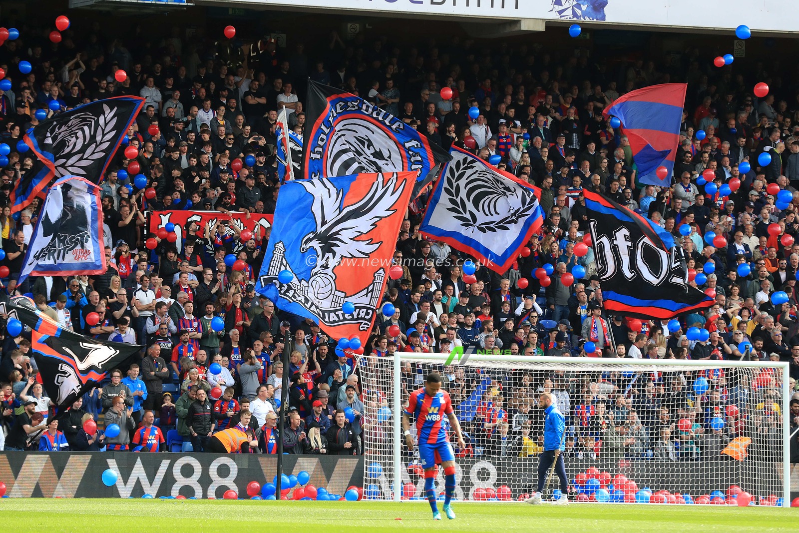 Crystal Palace fans wave flags and banners prior to kick off.