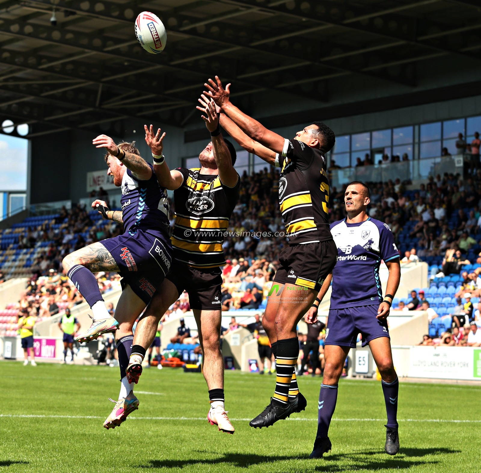 Kieran Buchanan of York Knights RLFC and Ben Jones-Bishop of York Knights RLFC jump to catch the ball during the Betfred Championship match York City Knights vs Featherstone Rovers at LNER Community Stadium, York, United Kingdom, 29th June 2025(Photo by Sam Eaden/News Images)