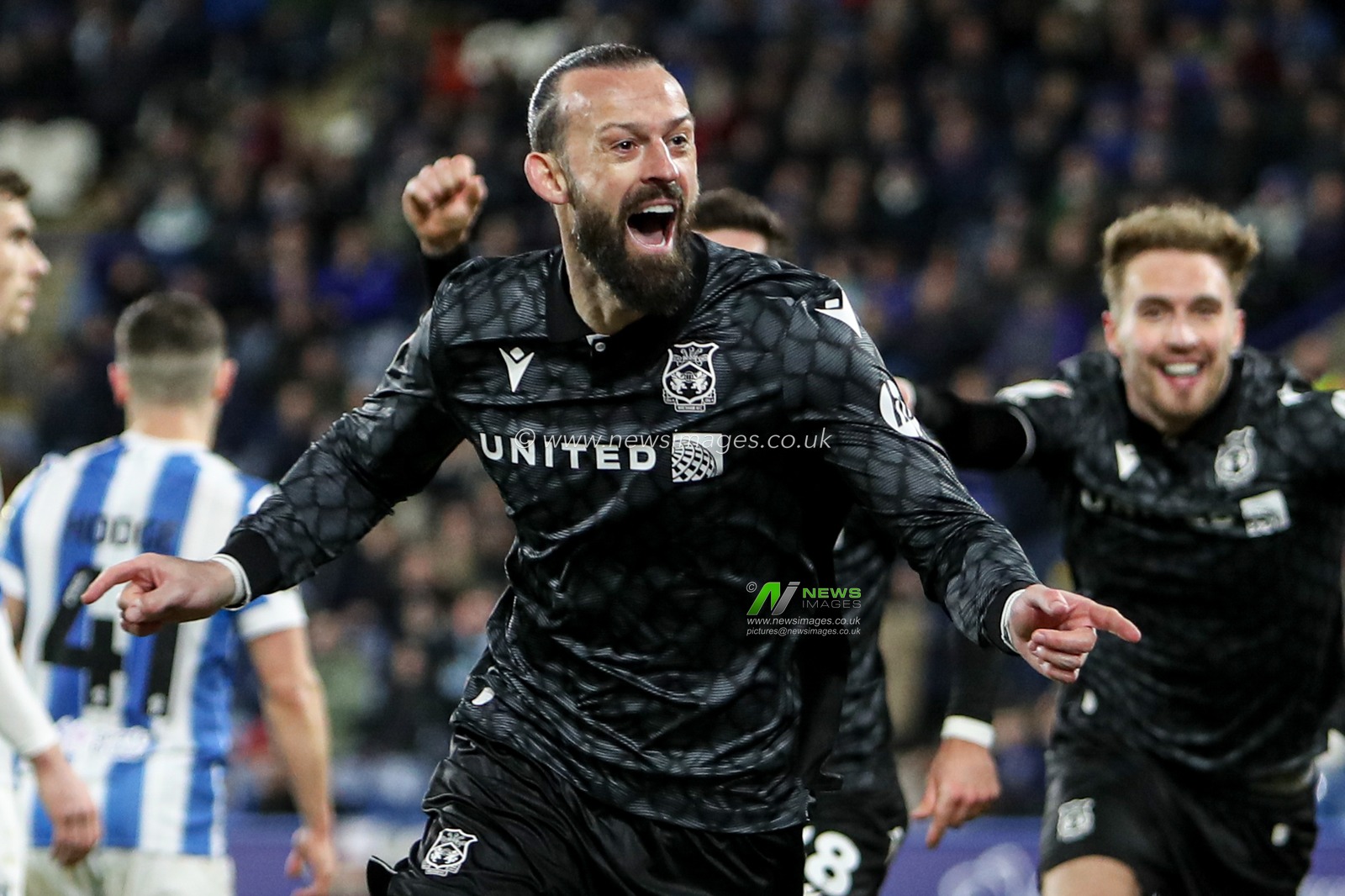Steven Fletcher of Wrexham celebrates goal after going 1-0 up during the Sky Bet League 1 match Huddersfield Town vs Wrexham at John Smith's Stadium, Huddersfield, United Kingdom, 4th March 2025

(Photo by Jorge Horsted/News Images)