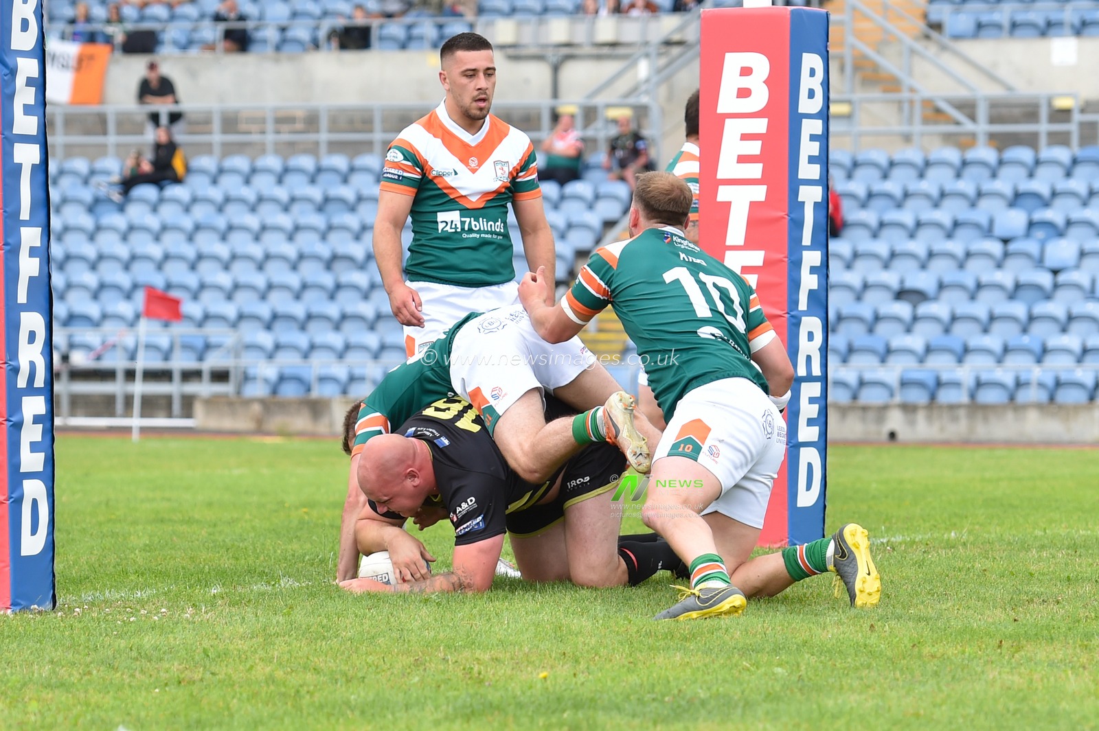Brad Brennan of North Wales Crusaders scores a try